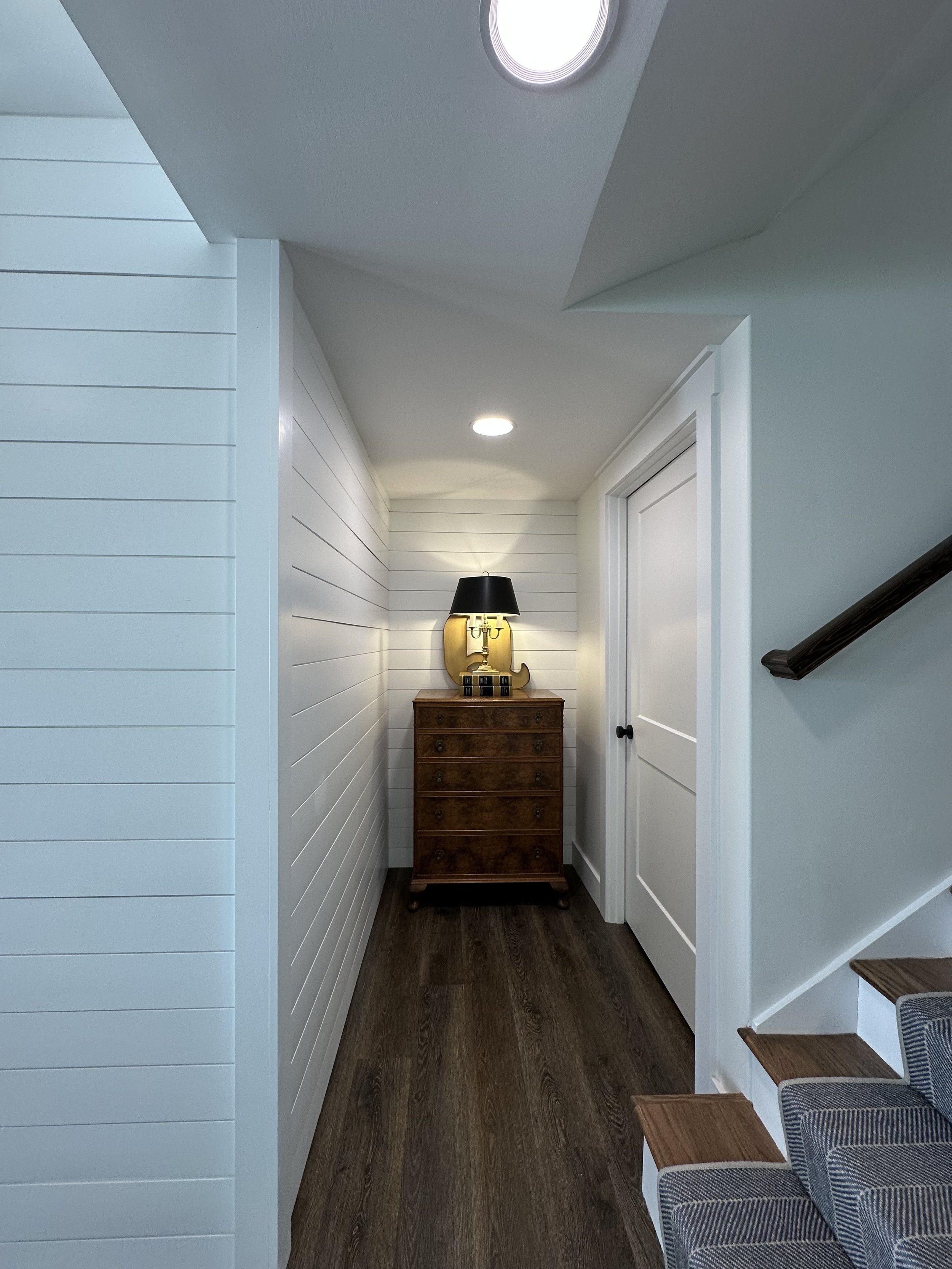 We closed off the long dark hallway that allowed us to use that space for an additional bathroom.