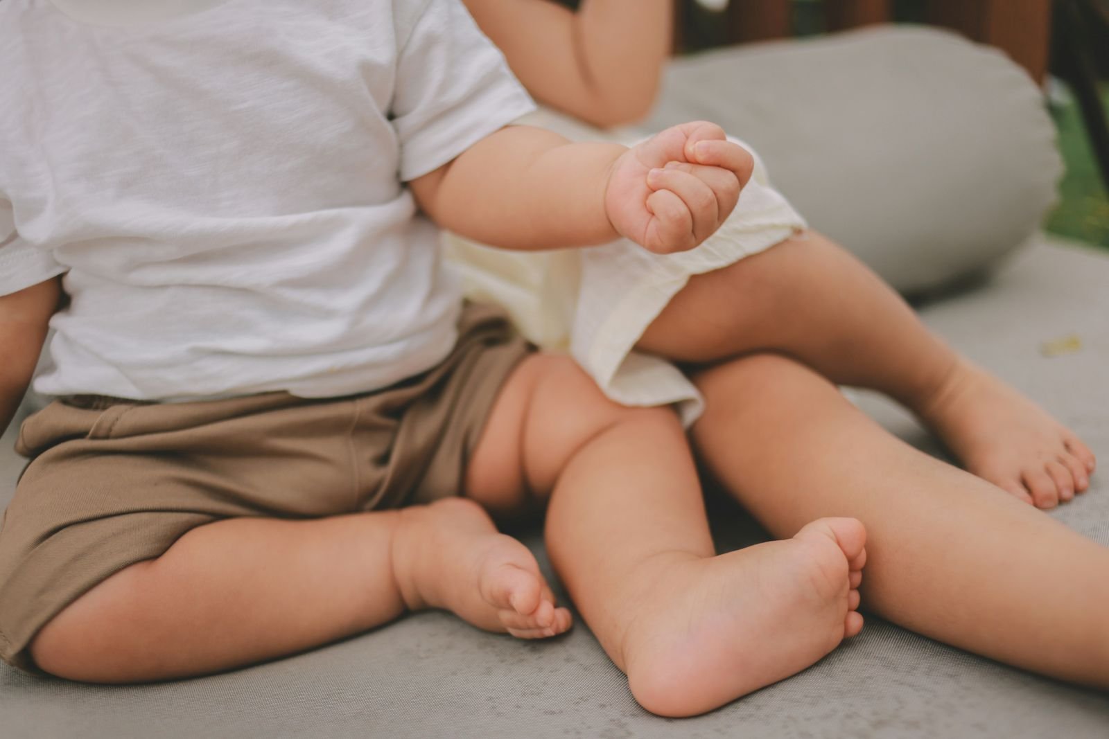 Baby-feet-toddler-feet-sitting-close-together