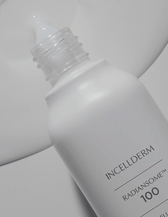 A white bottle of Incellderm Radiansome 100 skincare product with a clear nozzle cap against a white background.RIMAN Skincare | Incellderm Australia | Korean Skincare