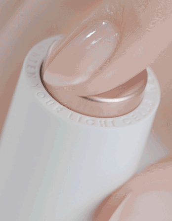 A finger pressing a button on a white electronic device with controlled light settings.RIMAN Skincare | Incellderm Australia | Korean Skincare