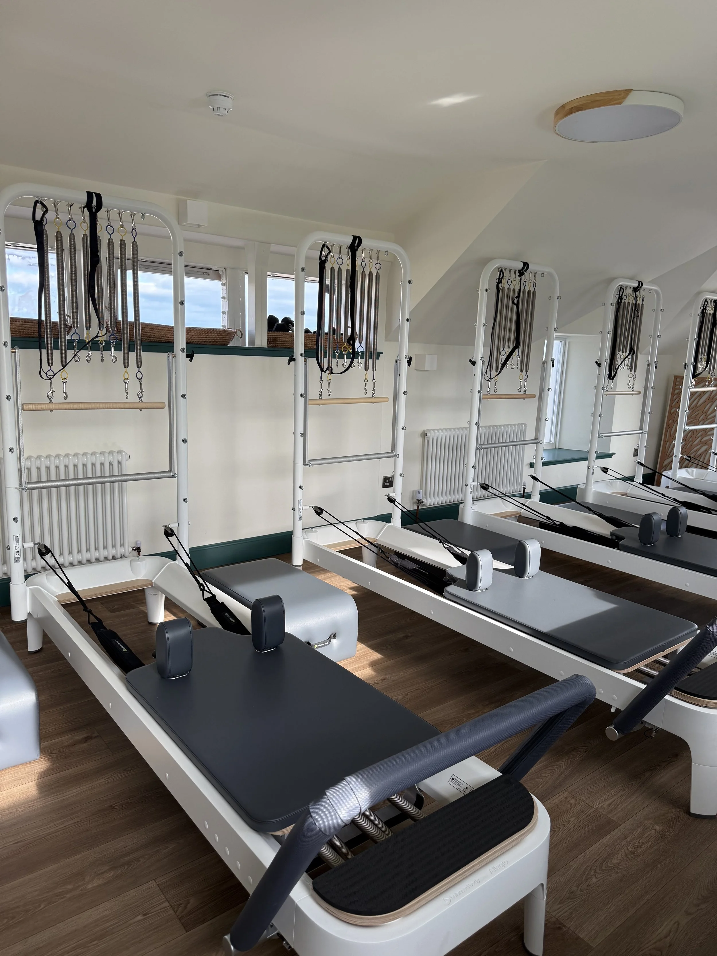 Sunlit room with six reformer towers 