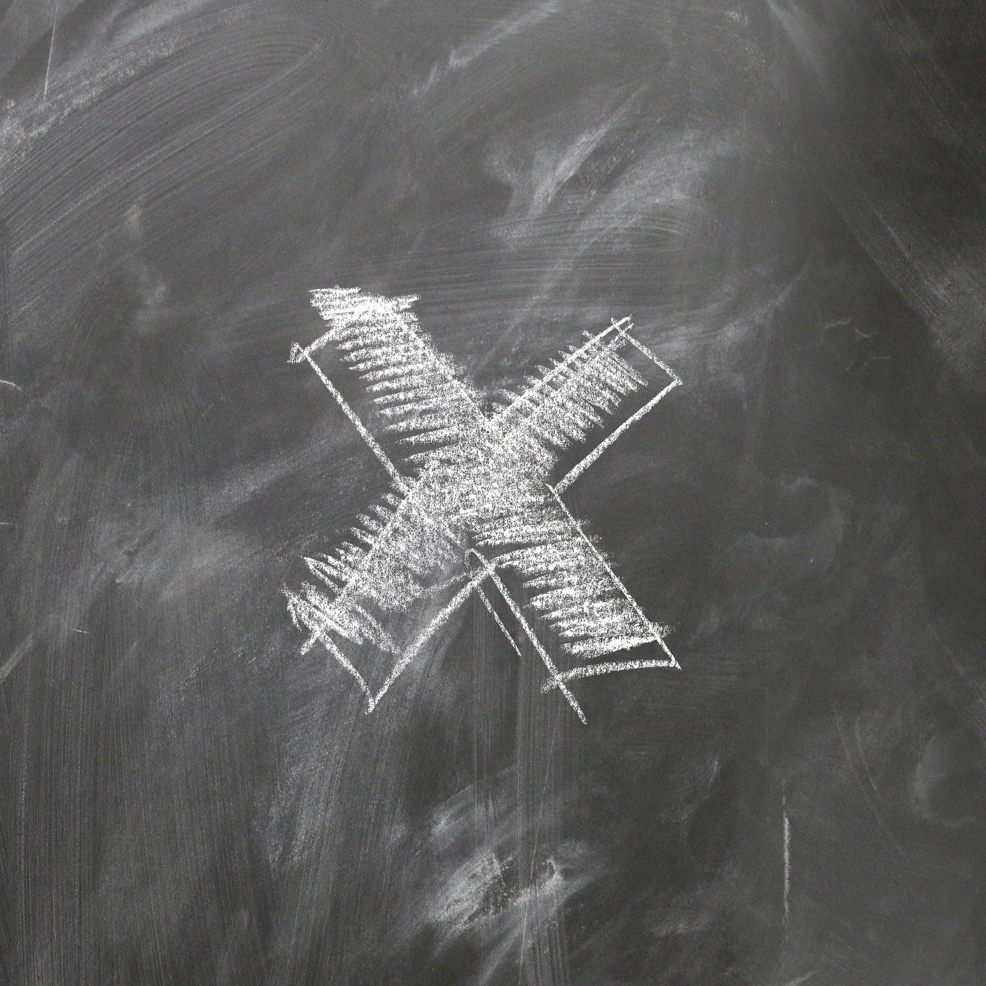 Chalk drawing of an overlapping 'X' on a blackboard.