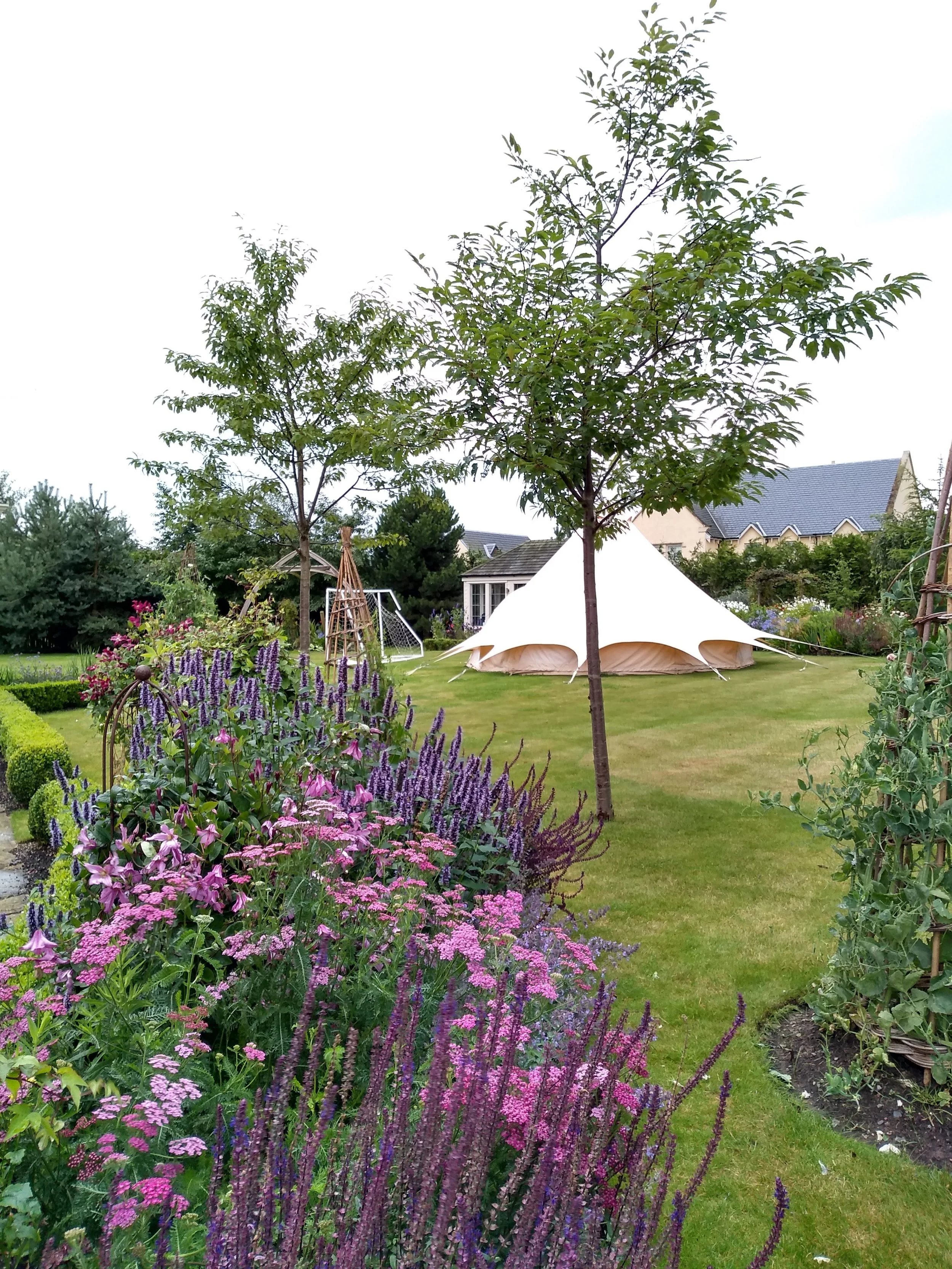 Summer borders filled with flowering perennials.