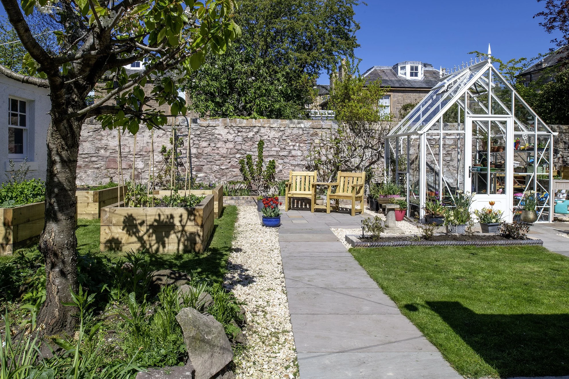 Central Edinburgh kitchen garden with raised beds and heritage glasshouse.