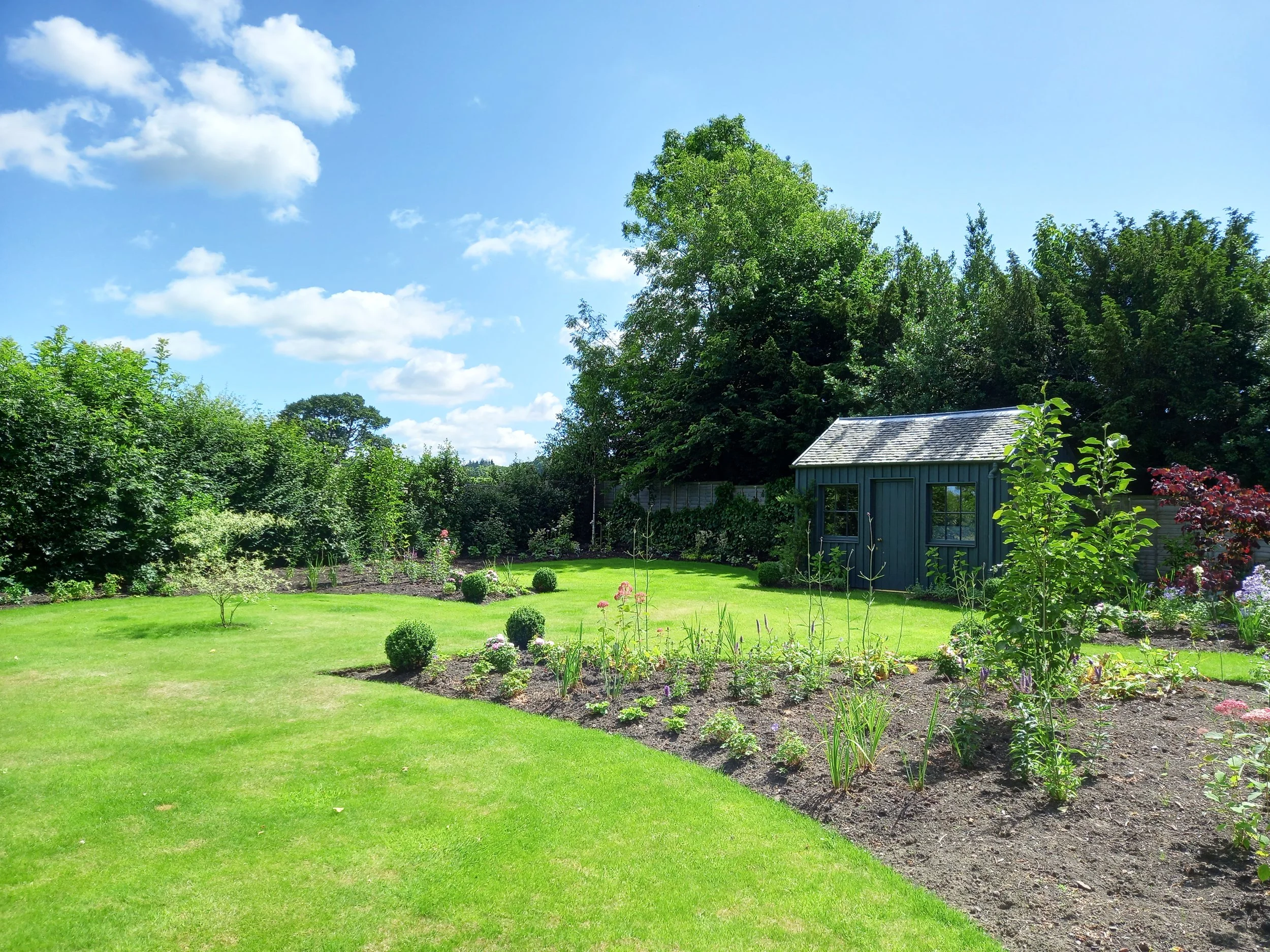 Planting beds being laid out in a large country garden.