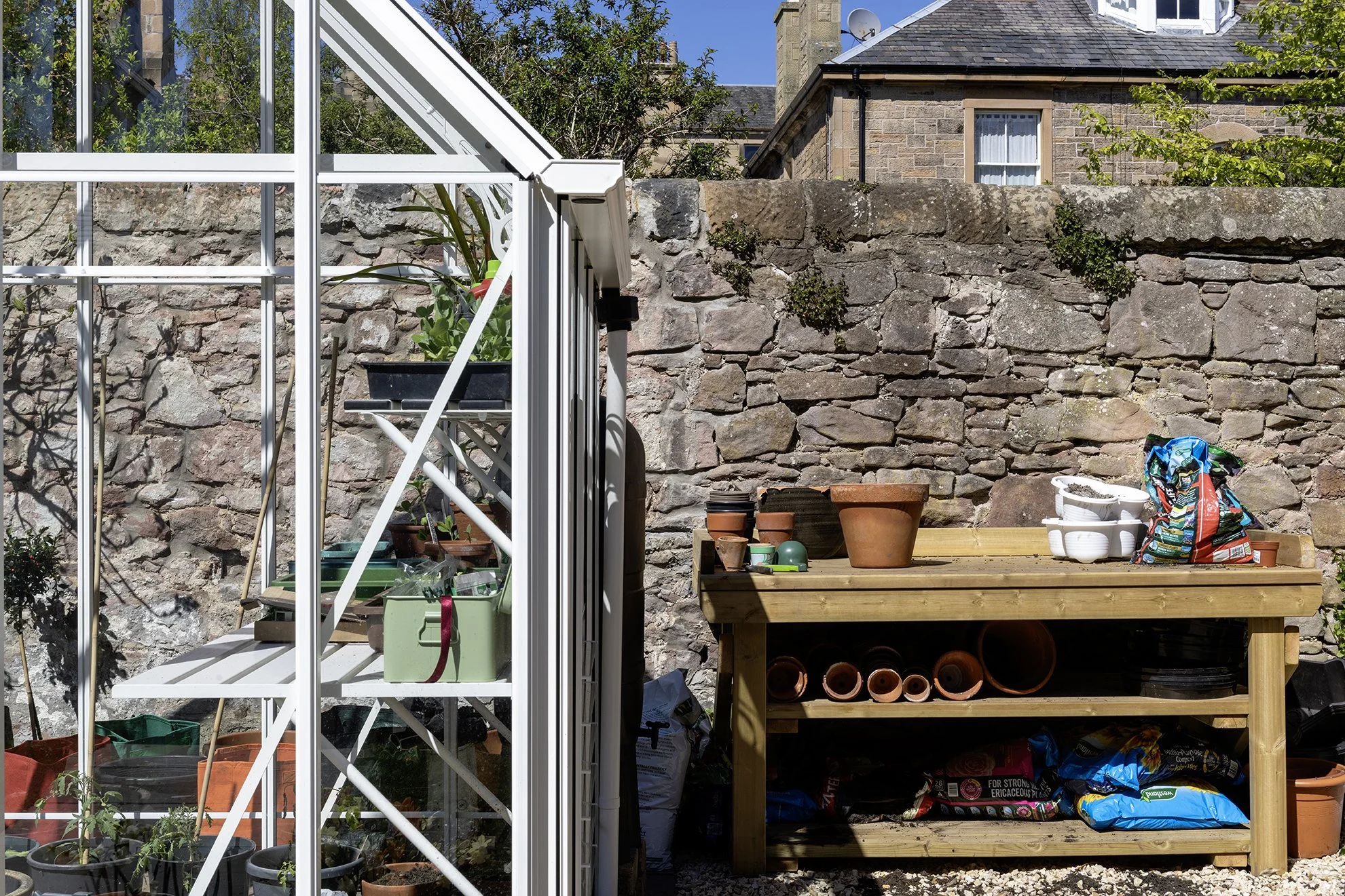 A potting bench, adjacent to a Victorian greenhouse, Edinburgh.