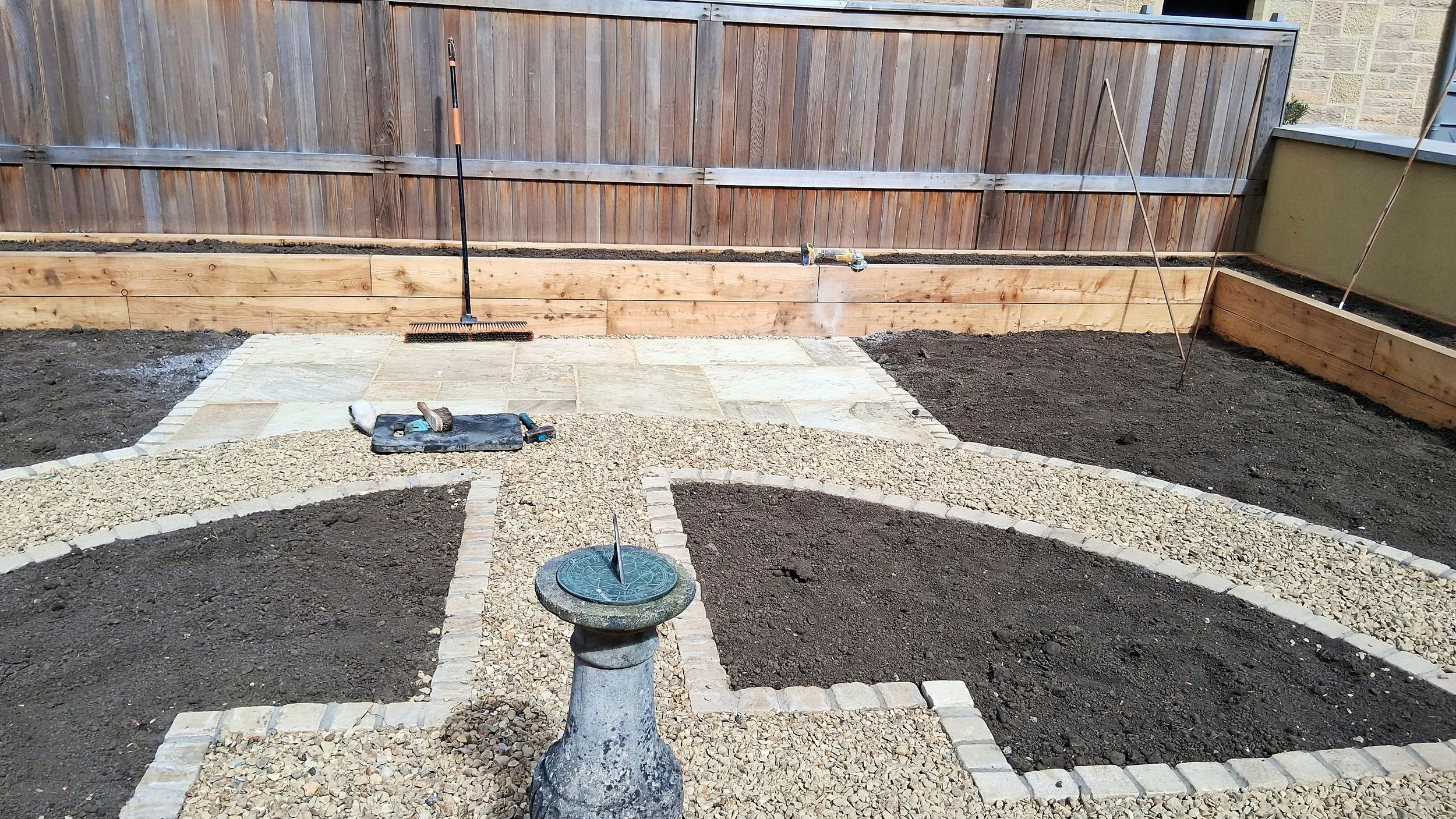 A newly built circular Potager garden with a central Sundial.
