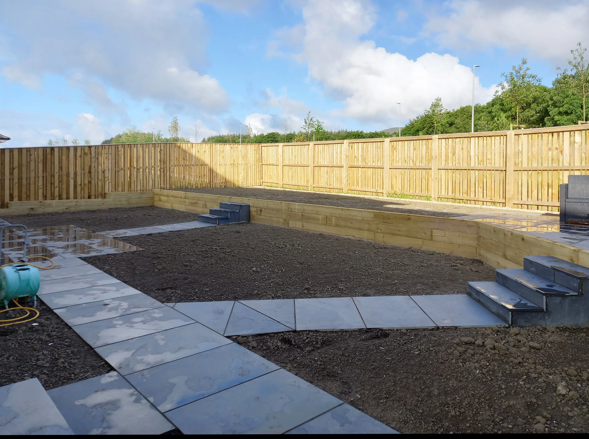 A newly designed and built garden waiting for plants.