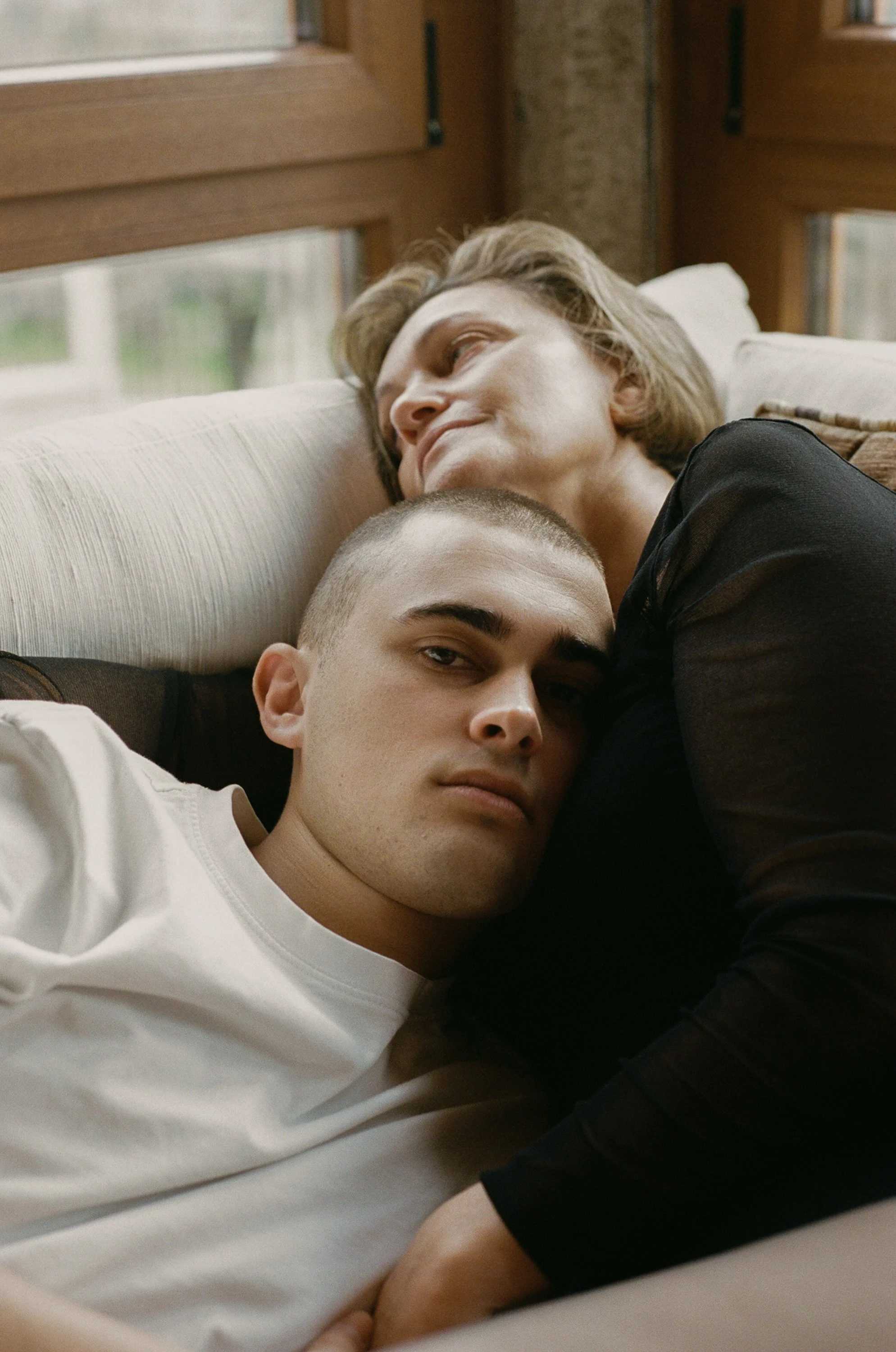 Portrait of mother and son hugging.
