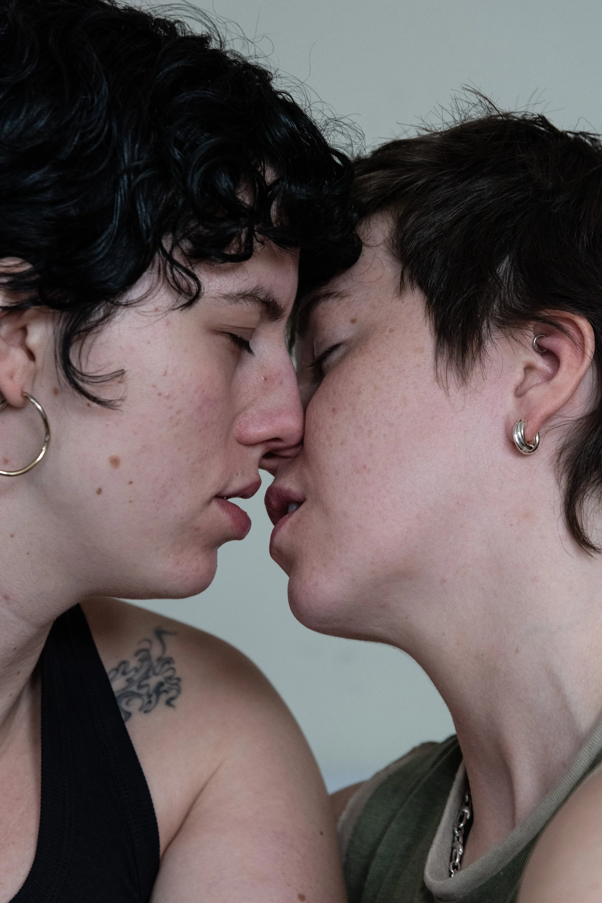 Portrait of two girls kissing.
