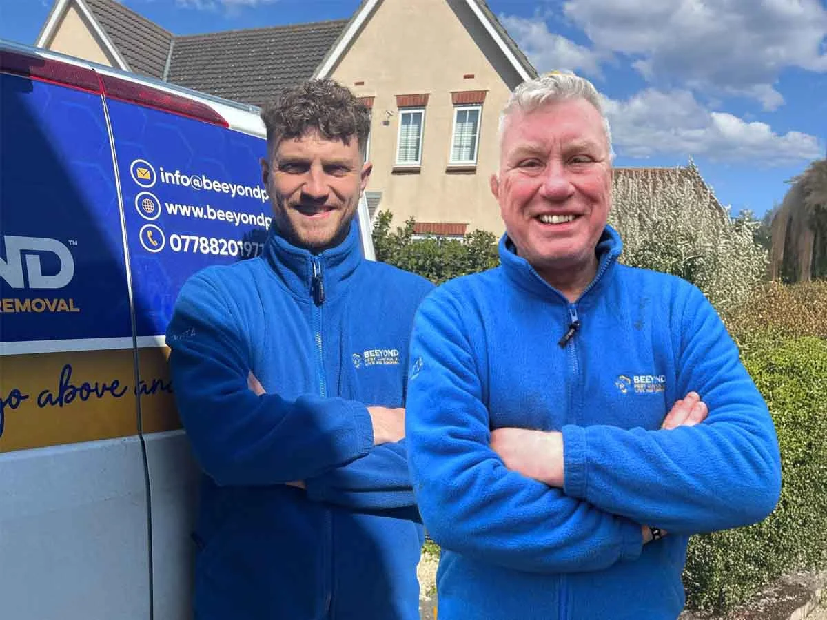 Beeyond Pest Control father and son team in blue uniforms standing by their branded van outside an Essex home, ready to provide local pest control services.