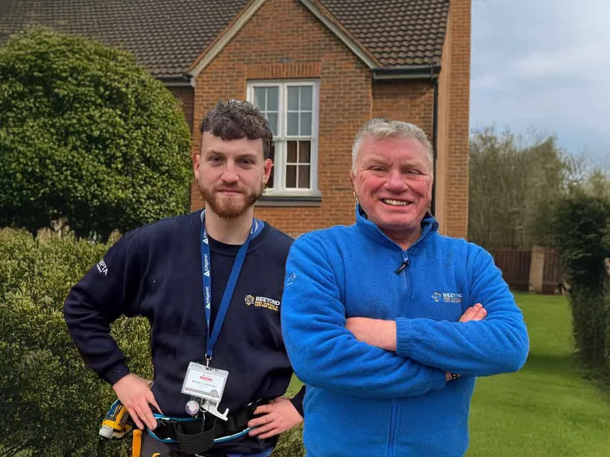 Mark and Mitch from Beeyond Pest Control standing outside a house in Essex, friendly local pest control experts ready to help homeowners