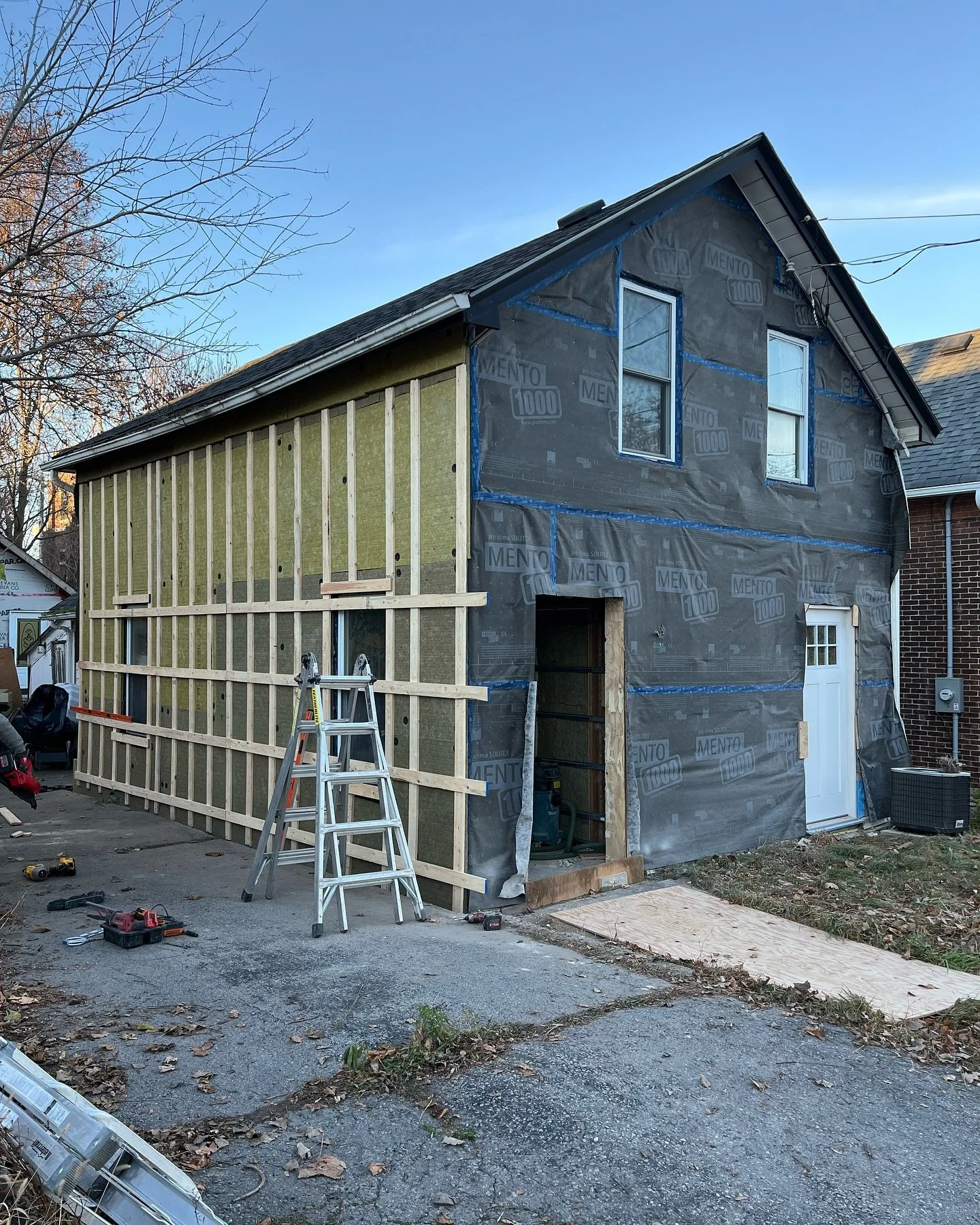 Our Mary St Duplex getting her blanket all buttoned up for the winter.