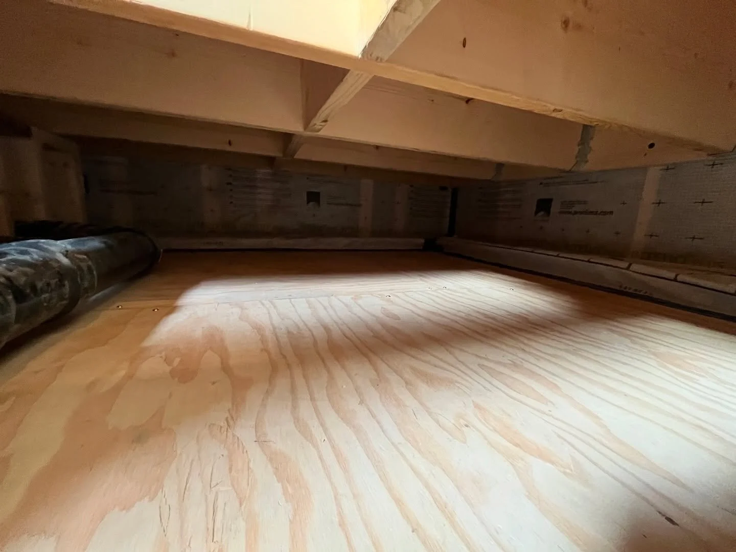 Not the sexiest finish photo, but these details matter just as much as the nice finish work. Insulated, air tight,  and affordable conditioned crawl space making the most out of the budget. 

R20 foam insulation acts as our vapor barrier under the 2 