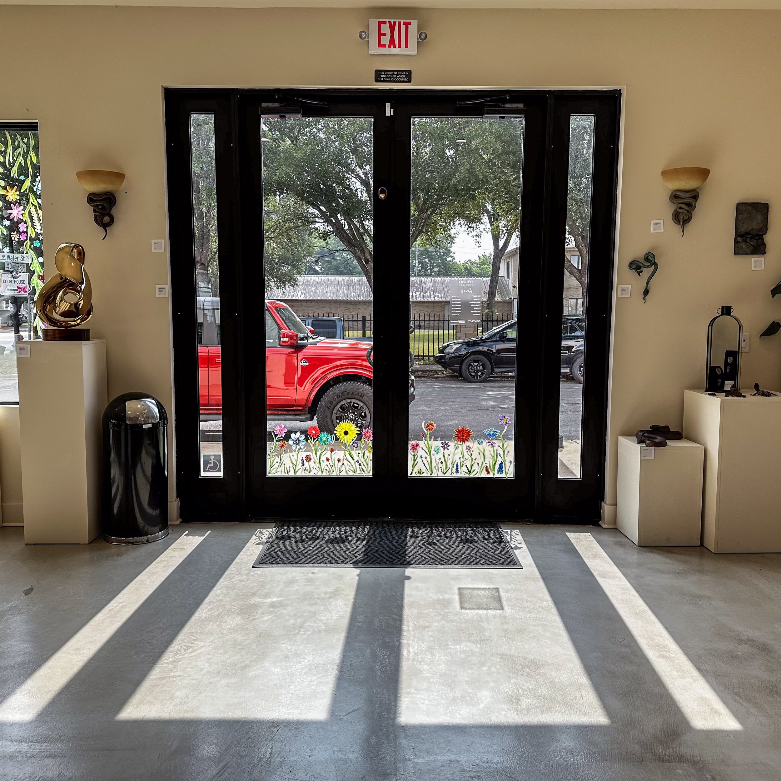 Black frames give this glass door an elegance that is true to the space and the doors let in lots of natural light.