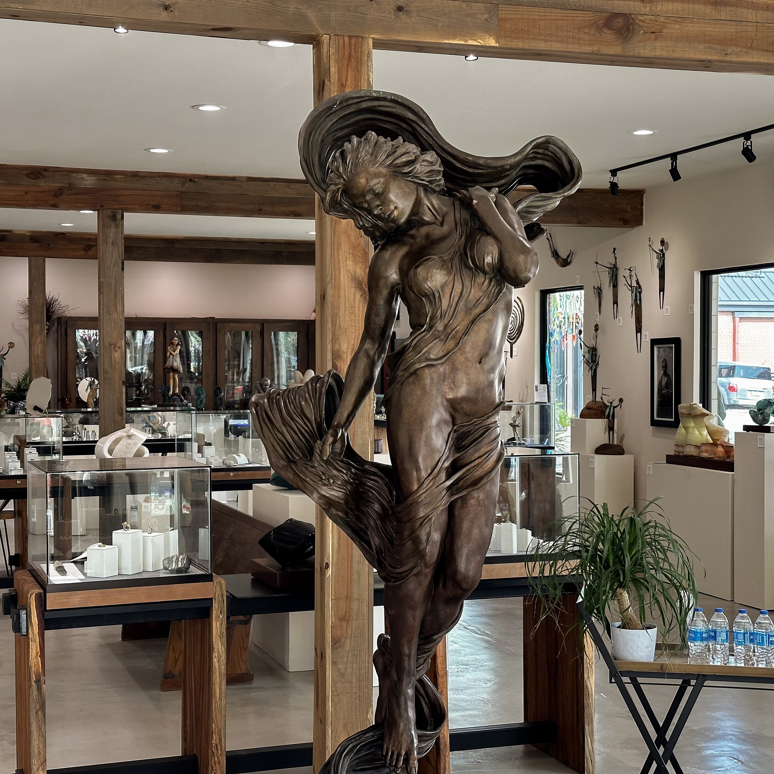 Stunning natural wood beams not only add support but lend their natural beauty to the showroom.