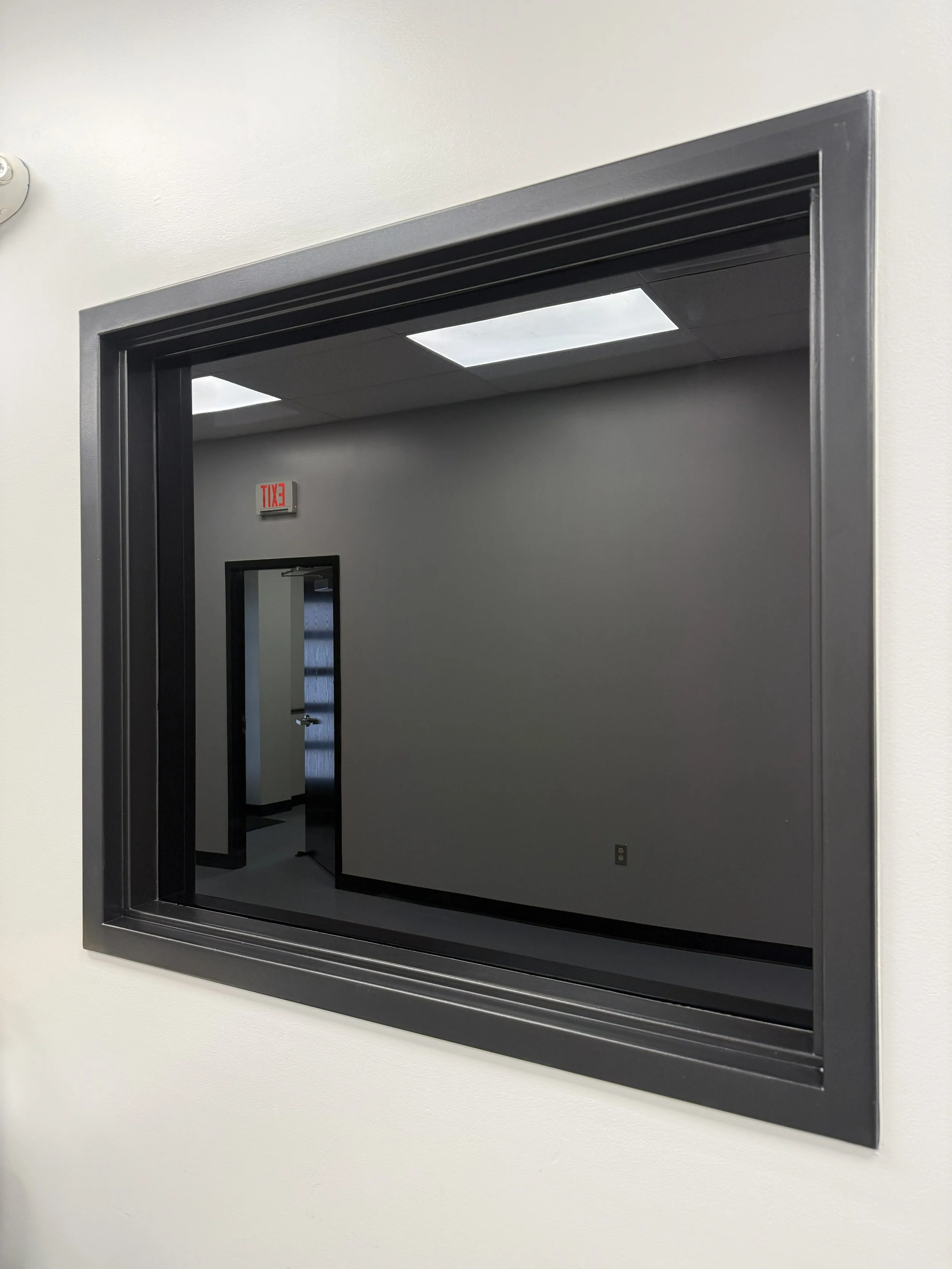 Blackout film installed on a window by Fine Line Auto Wraps in Holland, MI.