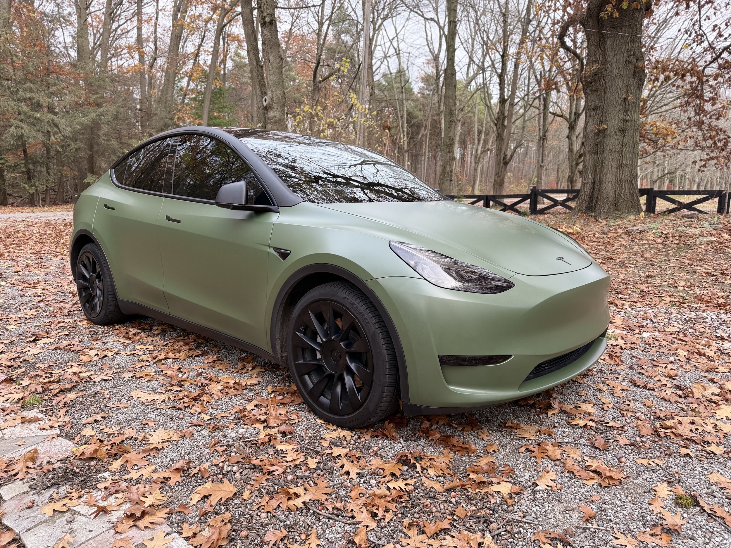 A green Tesla Model Y wrapped in color PPF.