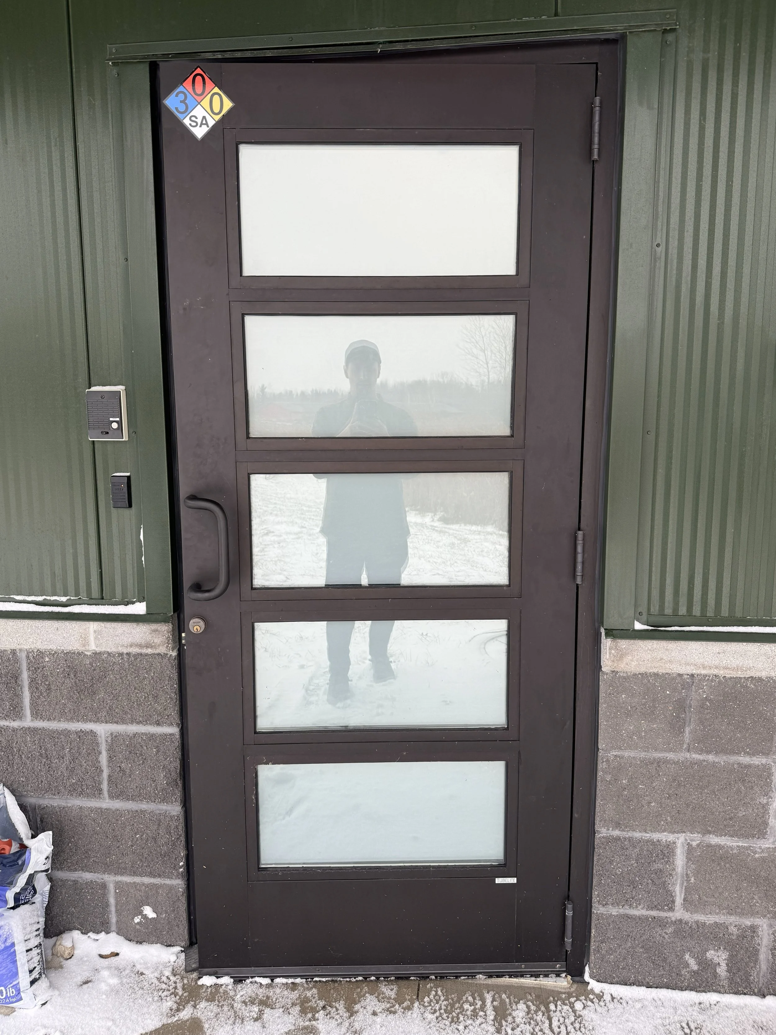 Window tint installed on a door by Fine Line Auto Wraps in Holland, MI.