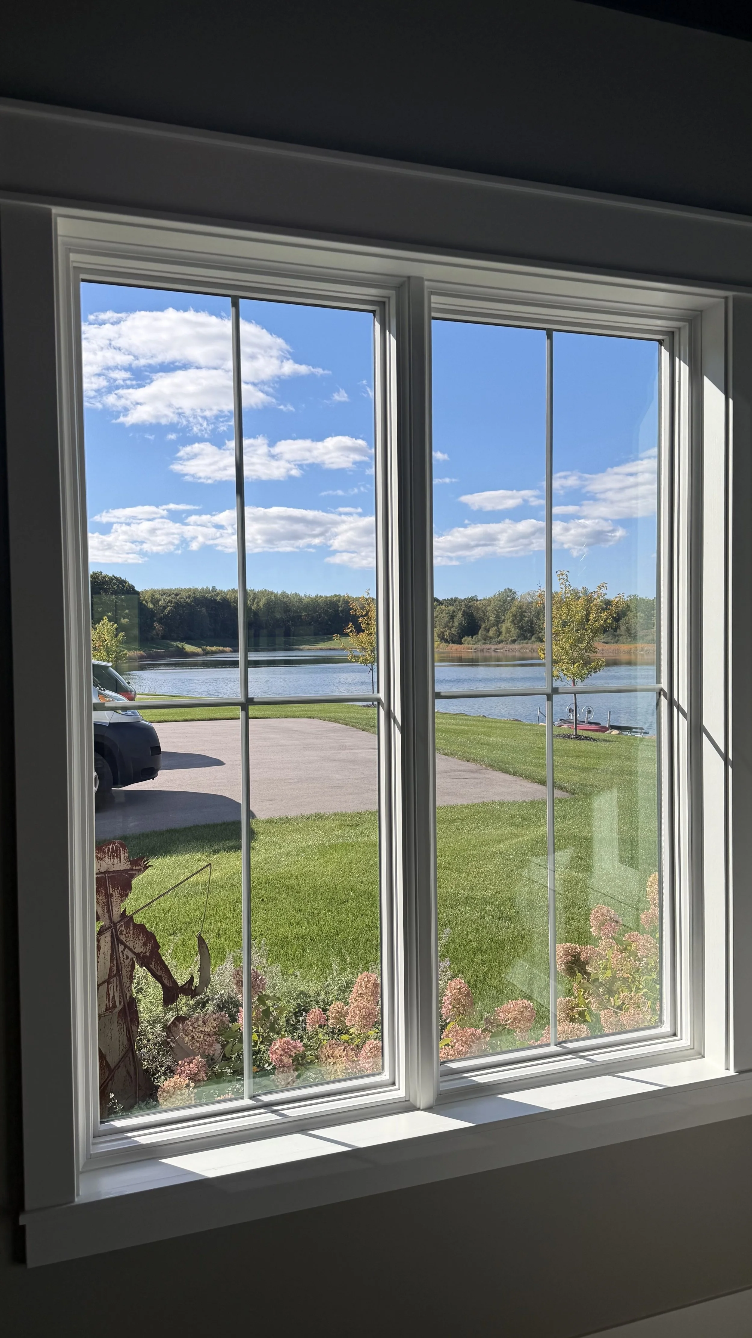 Window tint installed on a lake house by Fine Line Auto Wraps in Holland, MI.