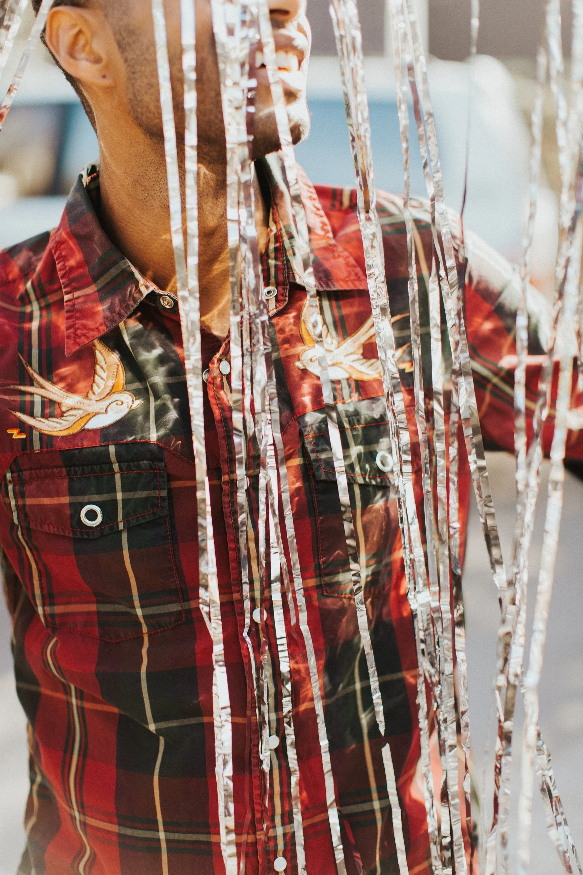 Patrick Sims wearing an upcycled pearl snap shirt by Triple Z Threadz.