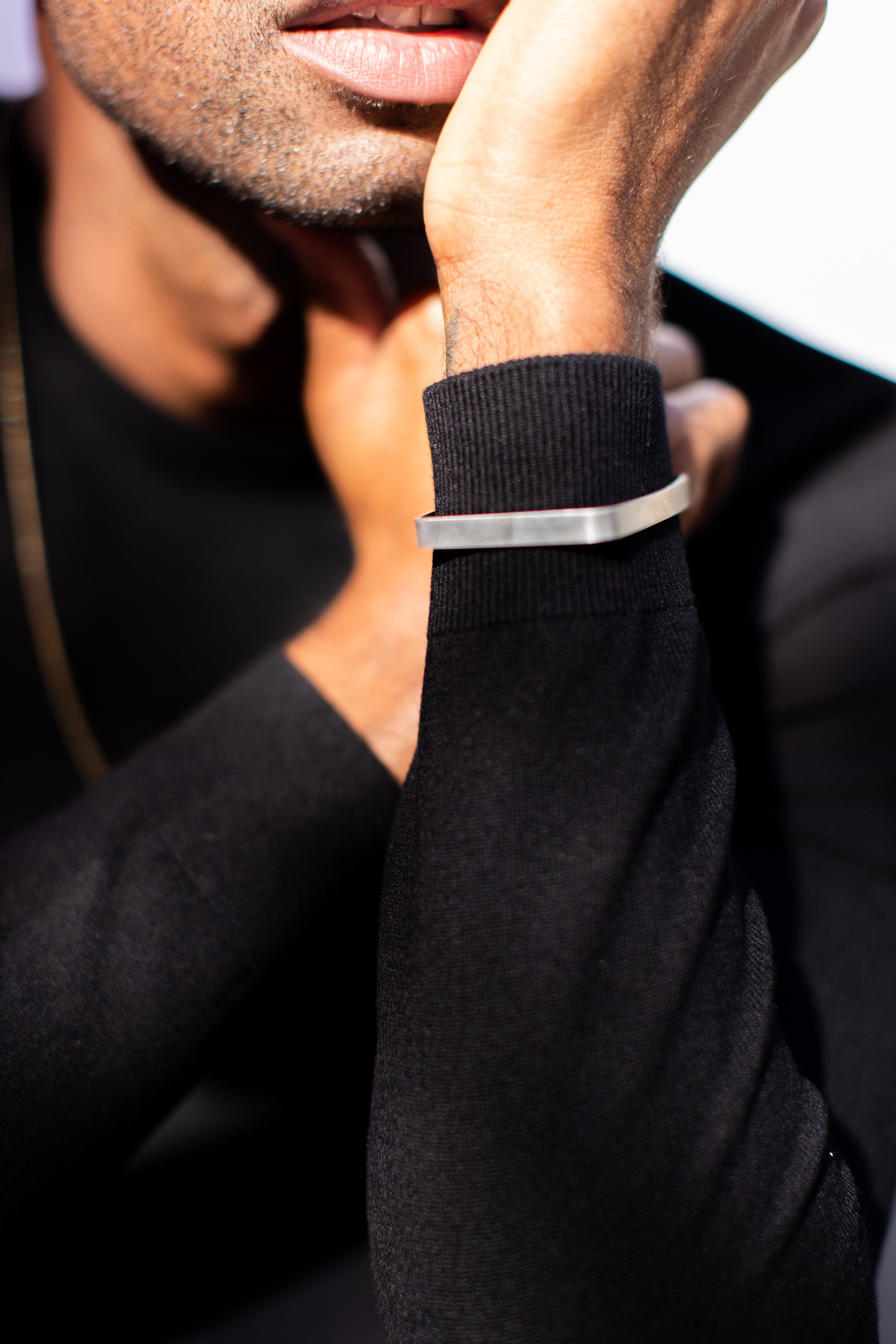 Patrick Sims modeling men's jewelry for Limbo Jewelry.