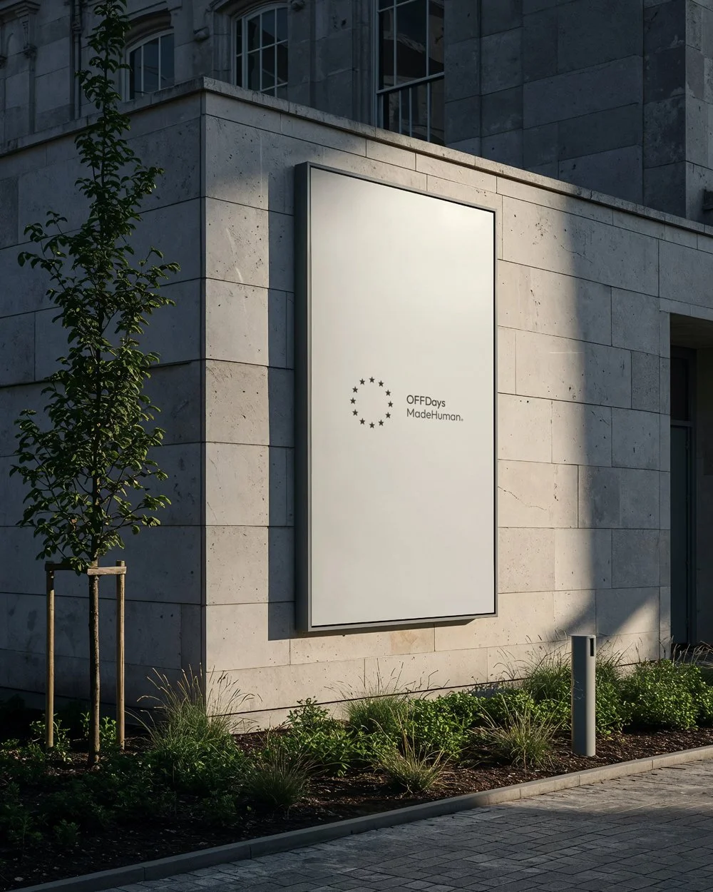 OFFDays lifestyle brand identity displayed on a minimalist street poster, featuring the symbol ring and MadeHuman signature. The restrained, typography-led design expresses clarity, calm and timeless contemporary branding.