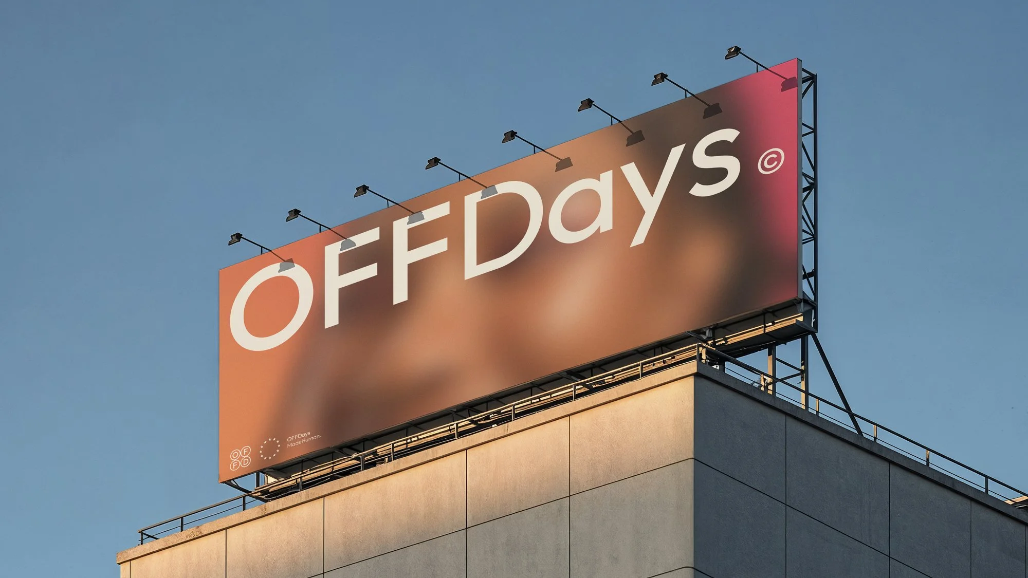 OFFDays lifestyle brand identity dominating a large outdoor billboard, featuring the bold wordmark over blurred photography. The minimal, typography-led system delivers confident, contemporary brand visibility at scale.