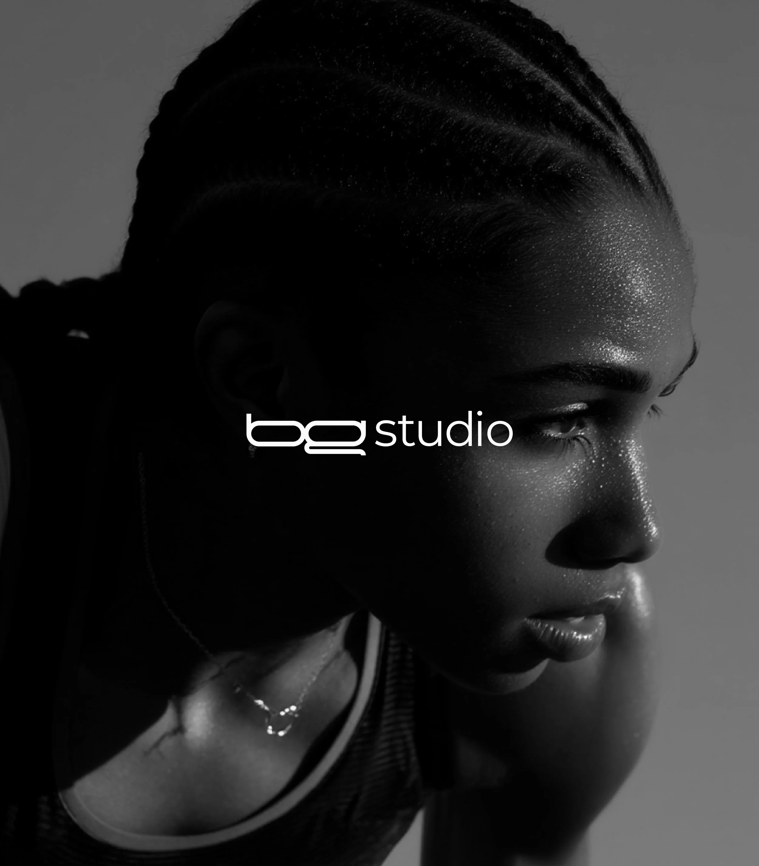 Monochrome brand image for BadDog Studio featuring a focused athlete in profile with the logo overlaid, expressing intensity, confidence, and a performance-led brand identity that refuses to blend in.