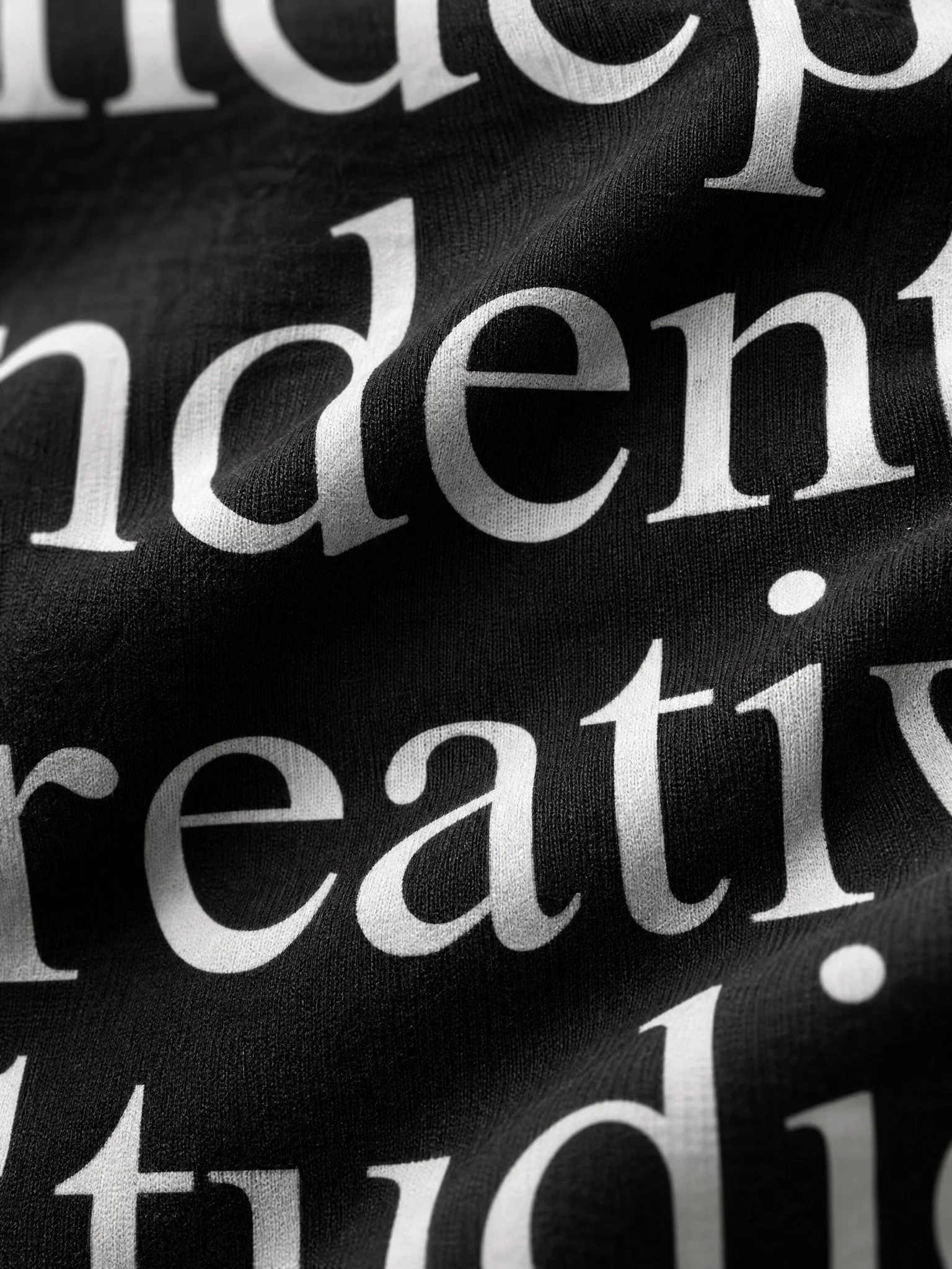 Workflow Studio brand identity design featuring bold white typography on black fabric, showcasing the monochrome visual identity and graphic design system of an independent Irish branding studio.