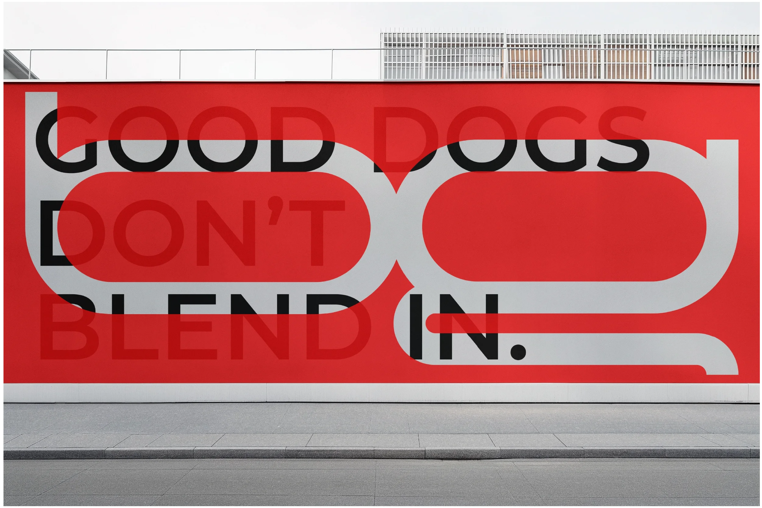 Oversized BadDog logo and campaign headline applied to a large-format wall banner, illustrating how the brand identity performs at architectural scale with maximum impact and clarity.