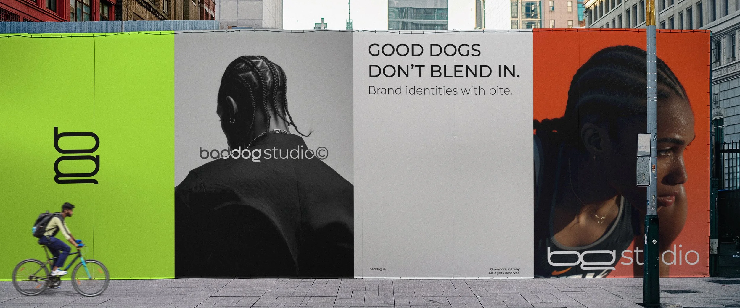 Large-scale outdoor billboard installation showcasing the BadDog brand identity across multiple panels, combining bold colour blocking, expressive imagery, and the logo system to demonstrate strong real-world brand presence.