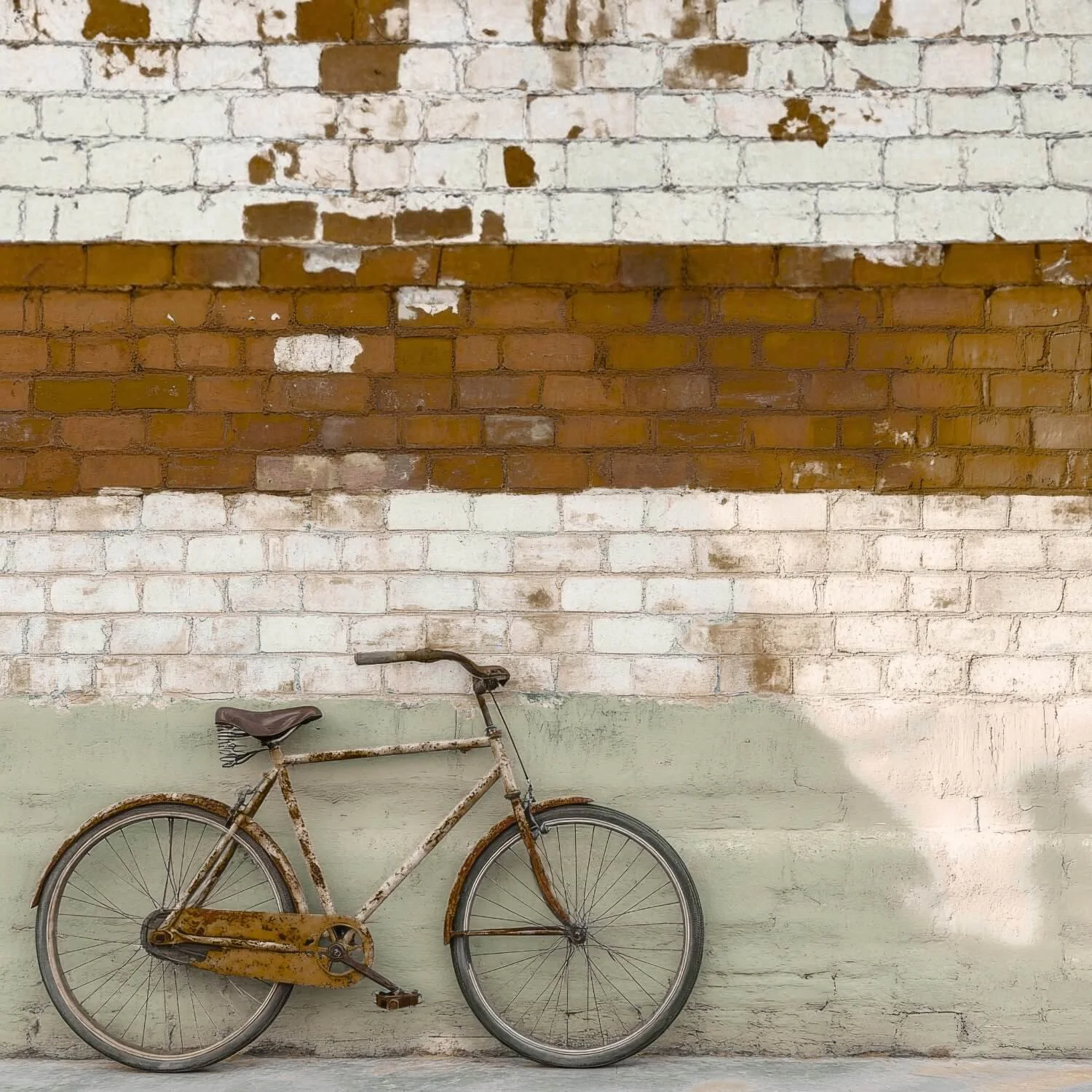 Rust-covered bicycle leaning against a weathered brick wall, symbolizing healing, self-worth, and addressing what lies beneath the surface.