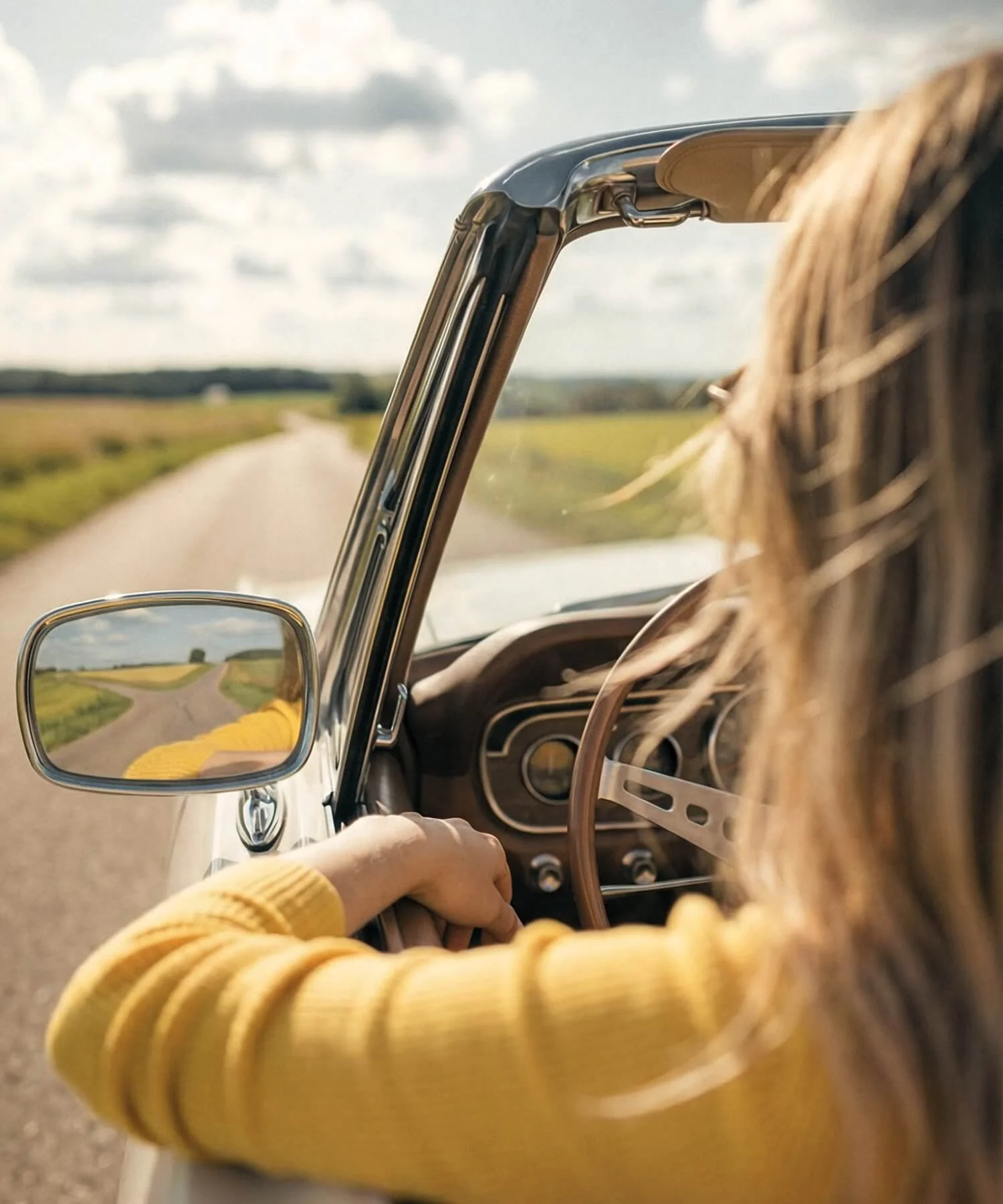 Woman driving on an open road, symbolizing guidance, life transitions, and support through personal growth and mental health counseling