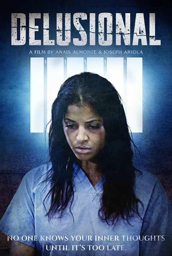 Poster for the film "Delusional" featuring a woman in a blue medical gown with a somber expression. The background has vertical white bars resembling jail bars and text reading: "No one knows your inner thoughts until it's too late." Directed by Anai