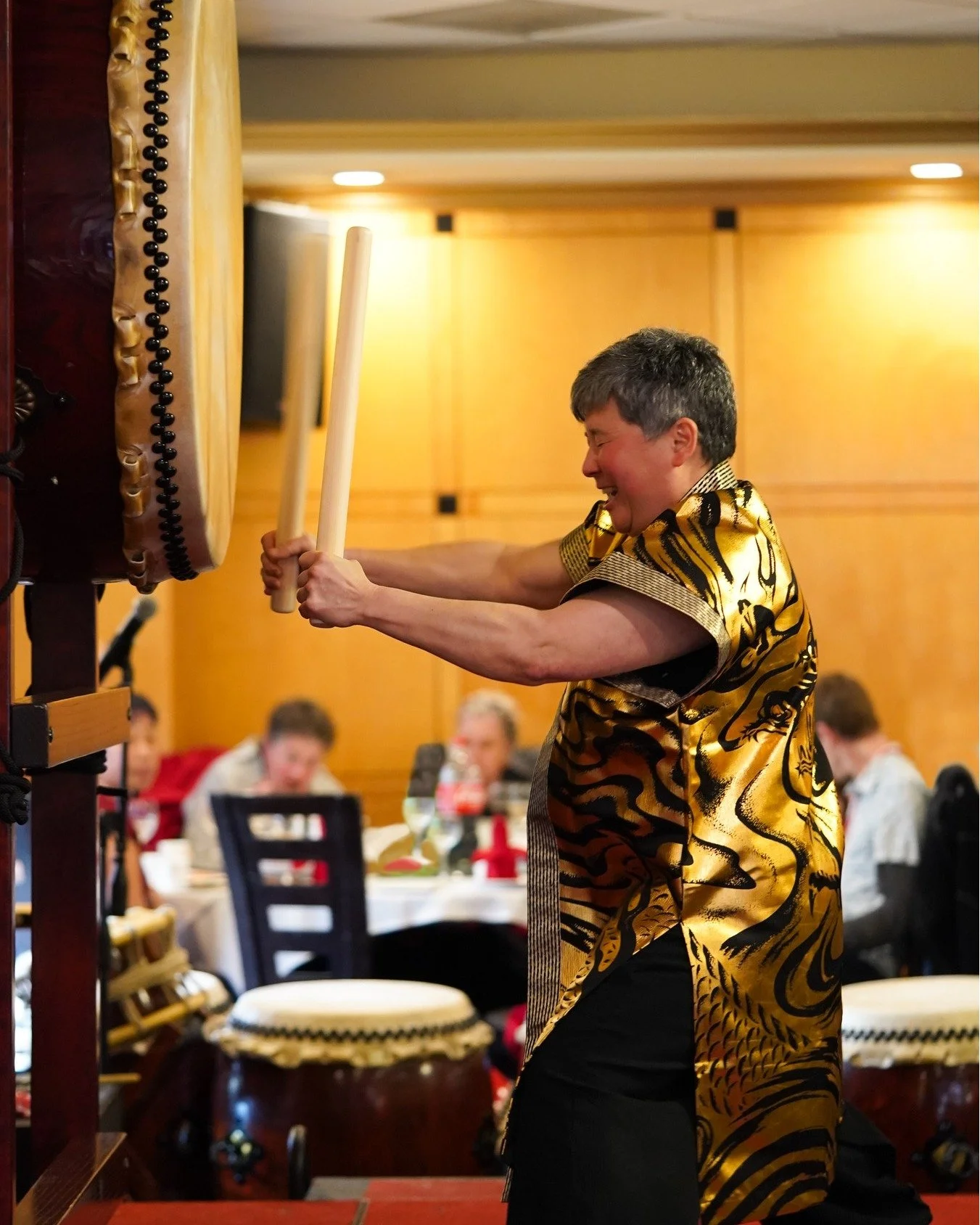 Taiko were once used to set the boundaries of villages. The drum would be played and people would walk out in all directions until the sound could just barely be heard. The drum was used to alert the community in times of danger, and to call people t