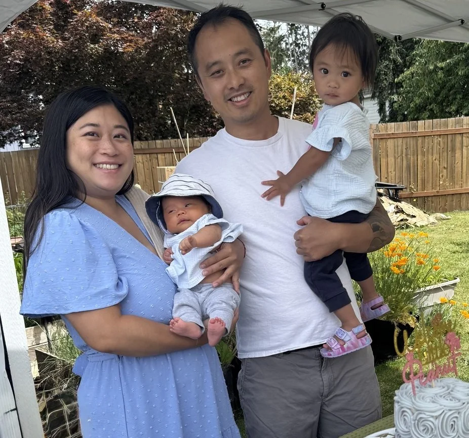 Meredith with her husband, toddler and new baby