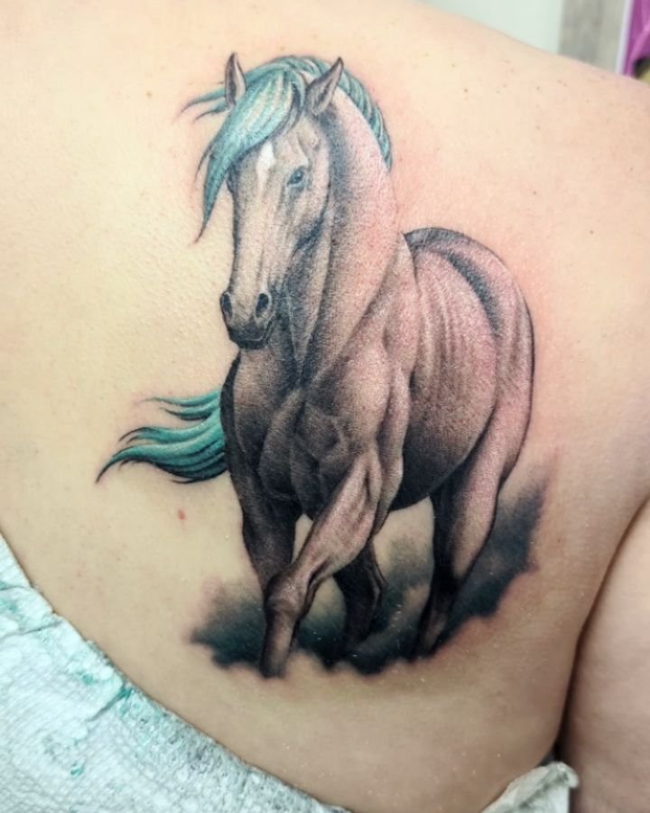 Horse designed for my clients daughters drawing. By: Nelson. Check out reel on @nelson.tattoos profile to see the  original drawing the design was based on 
#tattoo #customtattoo #customdesigned #horse #illustrativetattoo #colourtattoo #originalart #