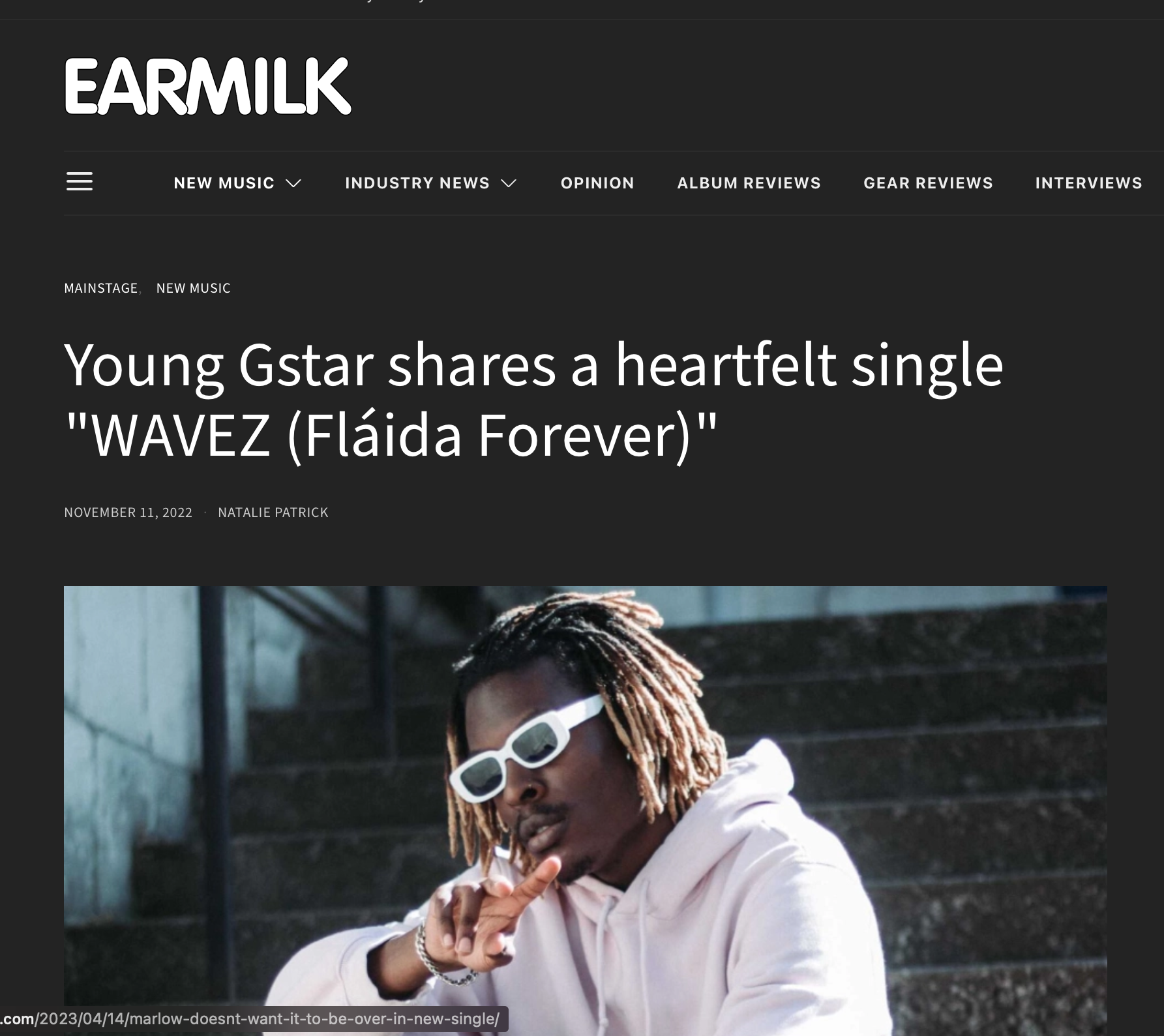Young Gstar feature on Earmilk discussing new single "WAVEZ (Fláida Forever)" with image of Young Gstar wearing sunglasses and a hoodie.