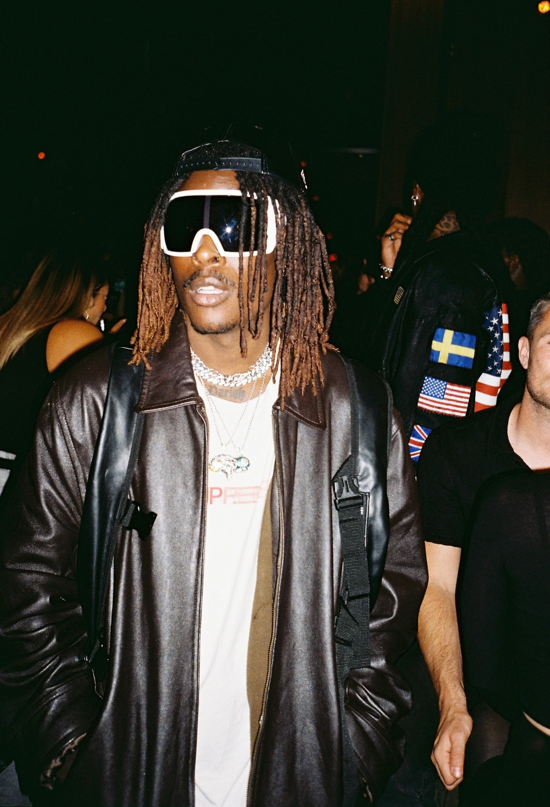 Shot of Musical Artist/Rapper Young Gstar with white goggle style sunglasses at a party