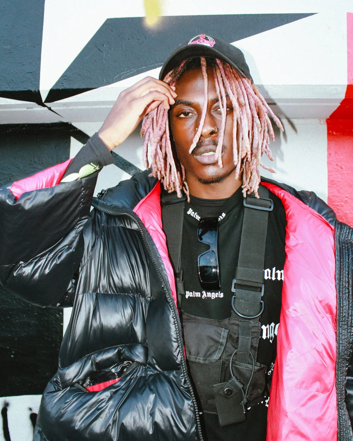 Image of Musical Artist/Rapper Young Gstar Wearing his brand; 'BLZRS' x New Era Cap