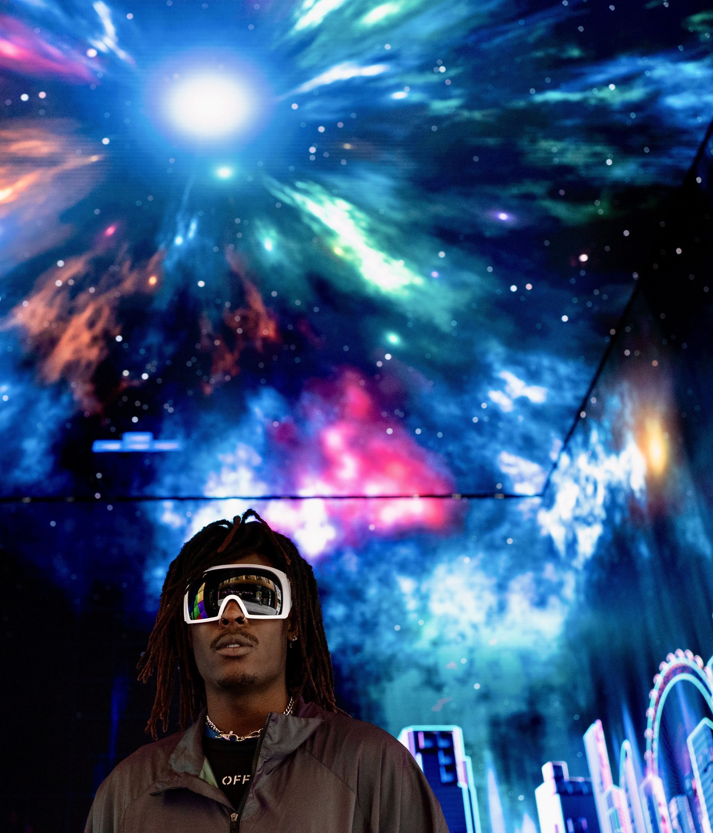 Shot of Musical Artist/Rapper Young Gstar with white goggle style sunglasses in space environment.
