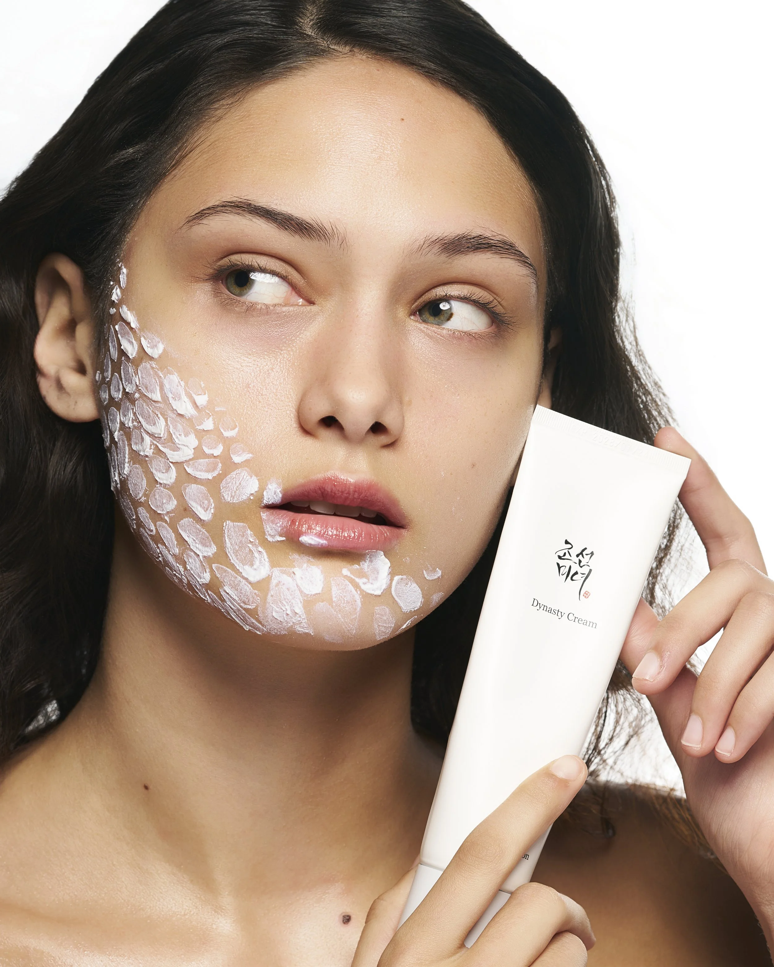 Clean beauty skincare product featuring a glowing model with textured cream application, highlighting hydration, radiance, and natural skin—perfect for skincare branding, e-commerce, and modern beauty campaigns.