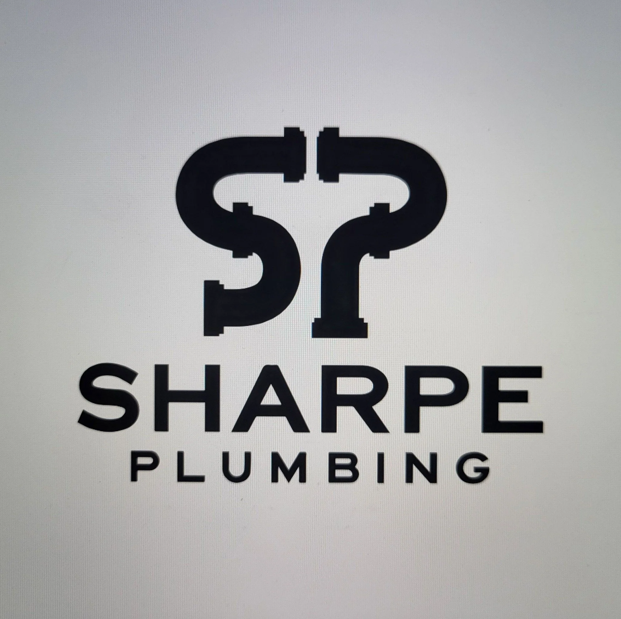 Logo for Sharpe Plumbing featuring interlocking pipe illustrations above the company name.