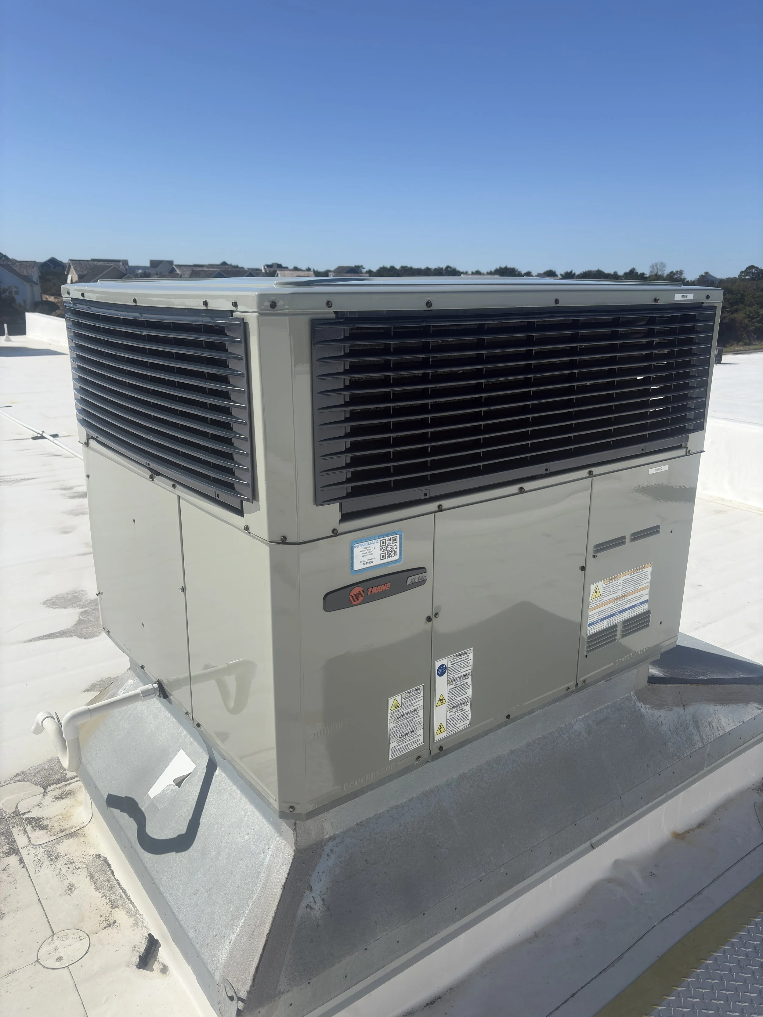 Commercial air conditioning unit installed on a building rooftop.
