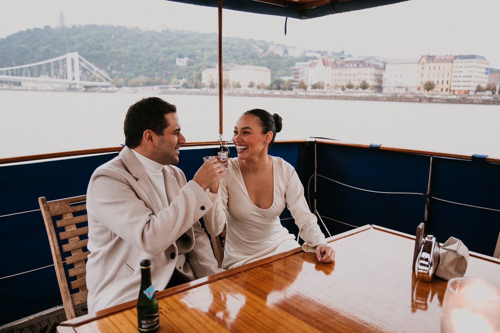 Budapest Private Yacht Night Proposal with Parliament View Photography and Planning, couple enjoying their drinks