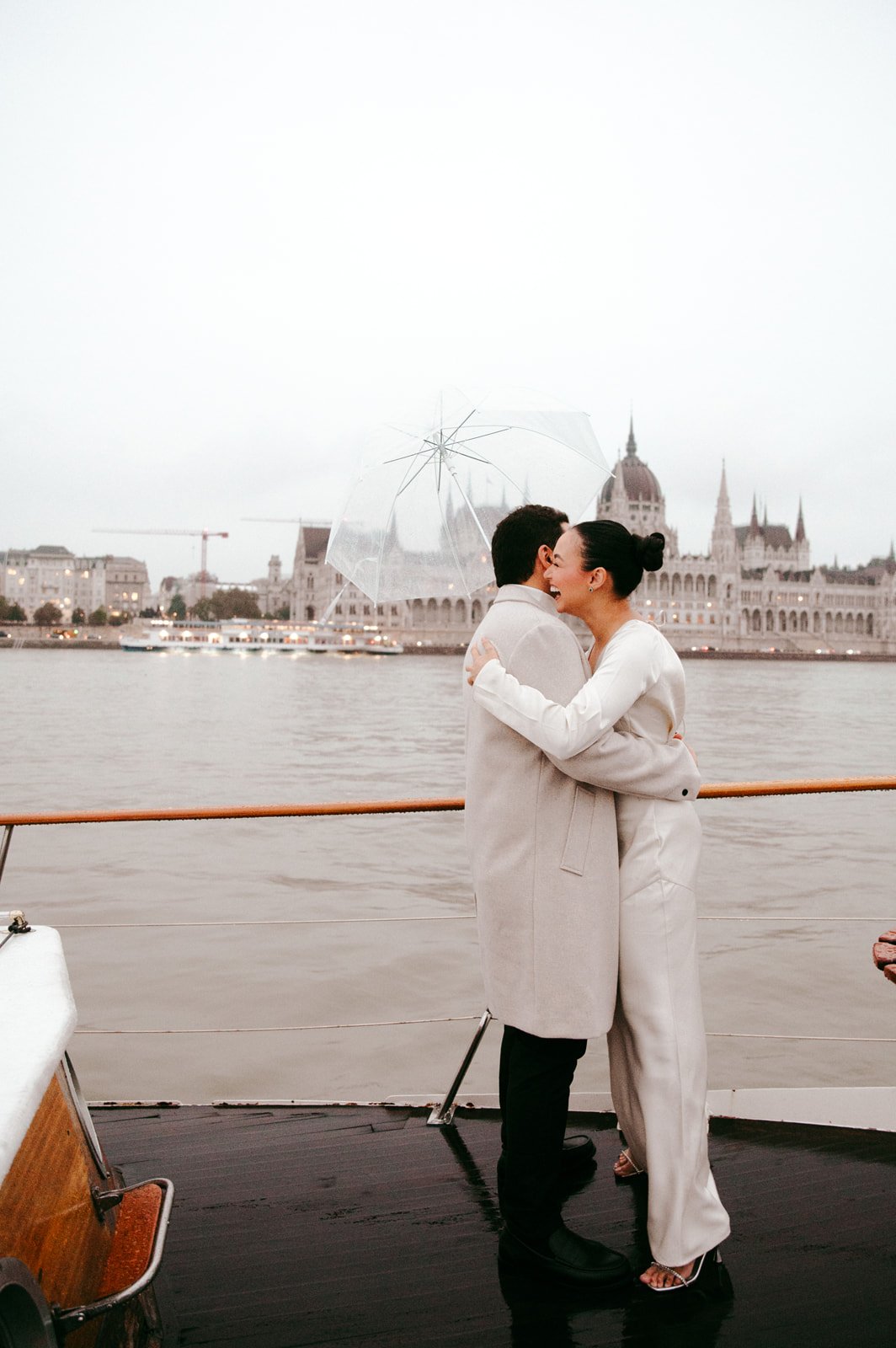 rainy but emotional day during Budapest Private Yacht Night Proposal with Parliament View Photography and Planning