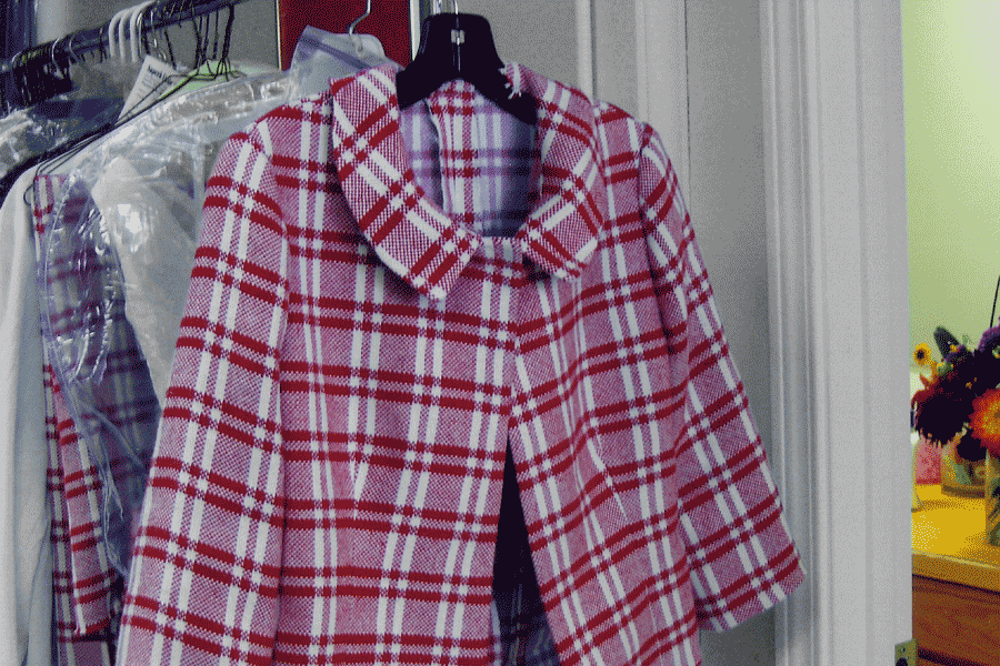 Red and white plaid coat on a hanger