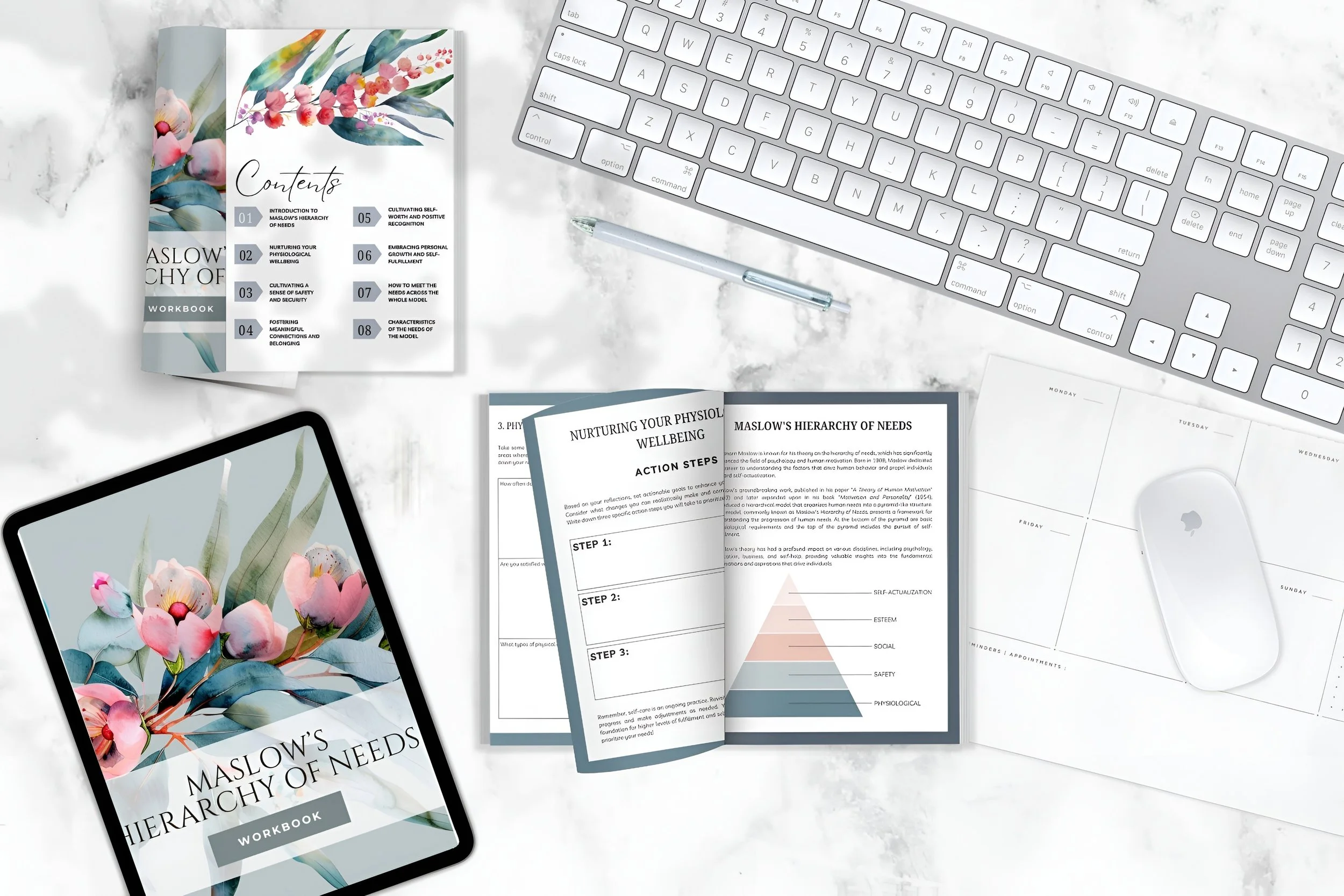 Workstation with a computer keyboard, tablet displaying 'Maslow's Hierarchy of Needs' workbook cover, printed workbook pages, a tablet, a pen, a wireless mouse, and a desk calendar on a white marble surface.