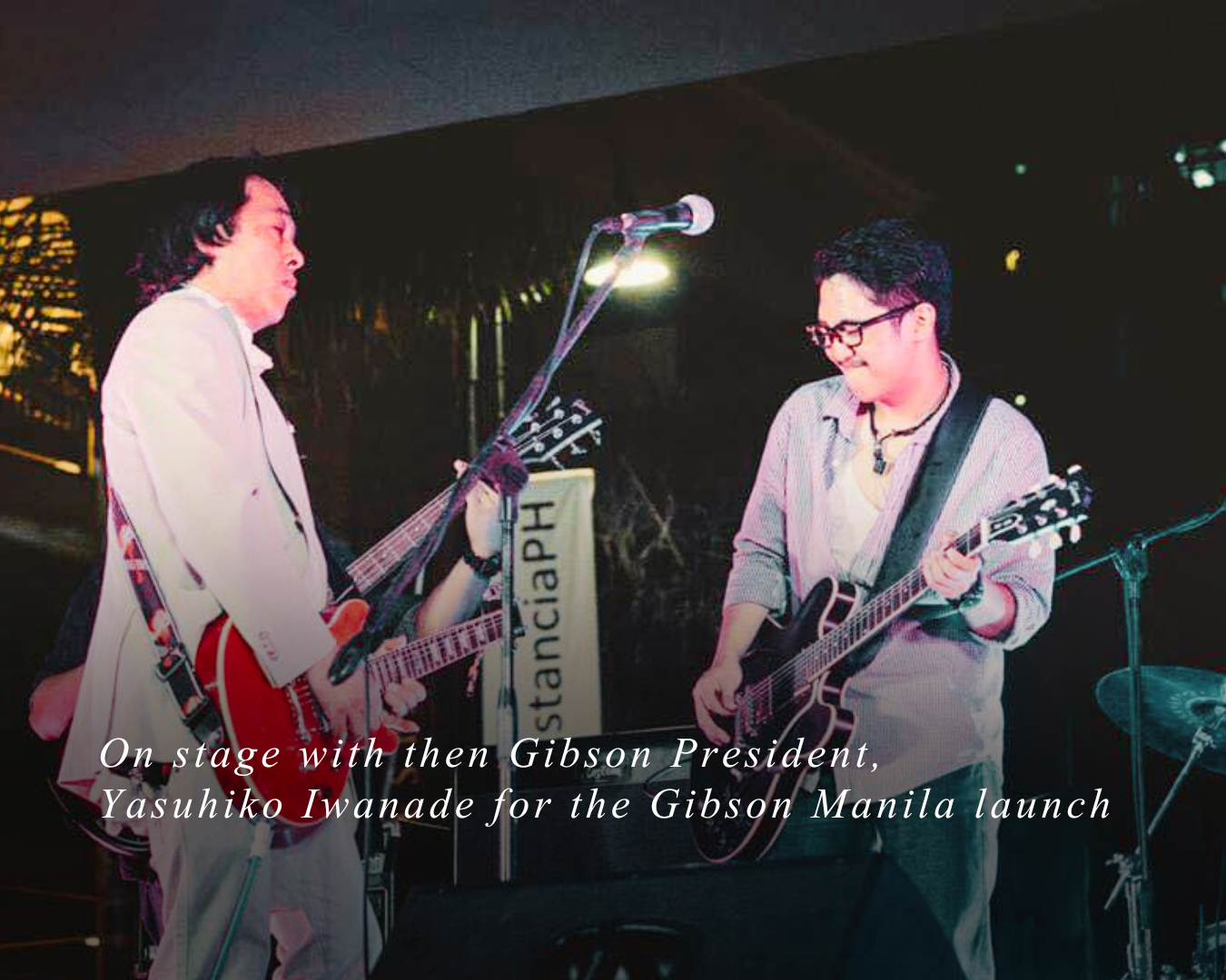 Gibson President Yasuhiko Iwanade shares the stage with Gibson brand ambassador Paul Marney for Gibson Manila's launch